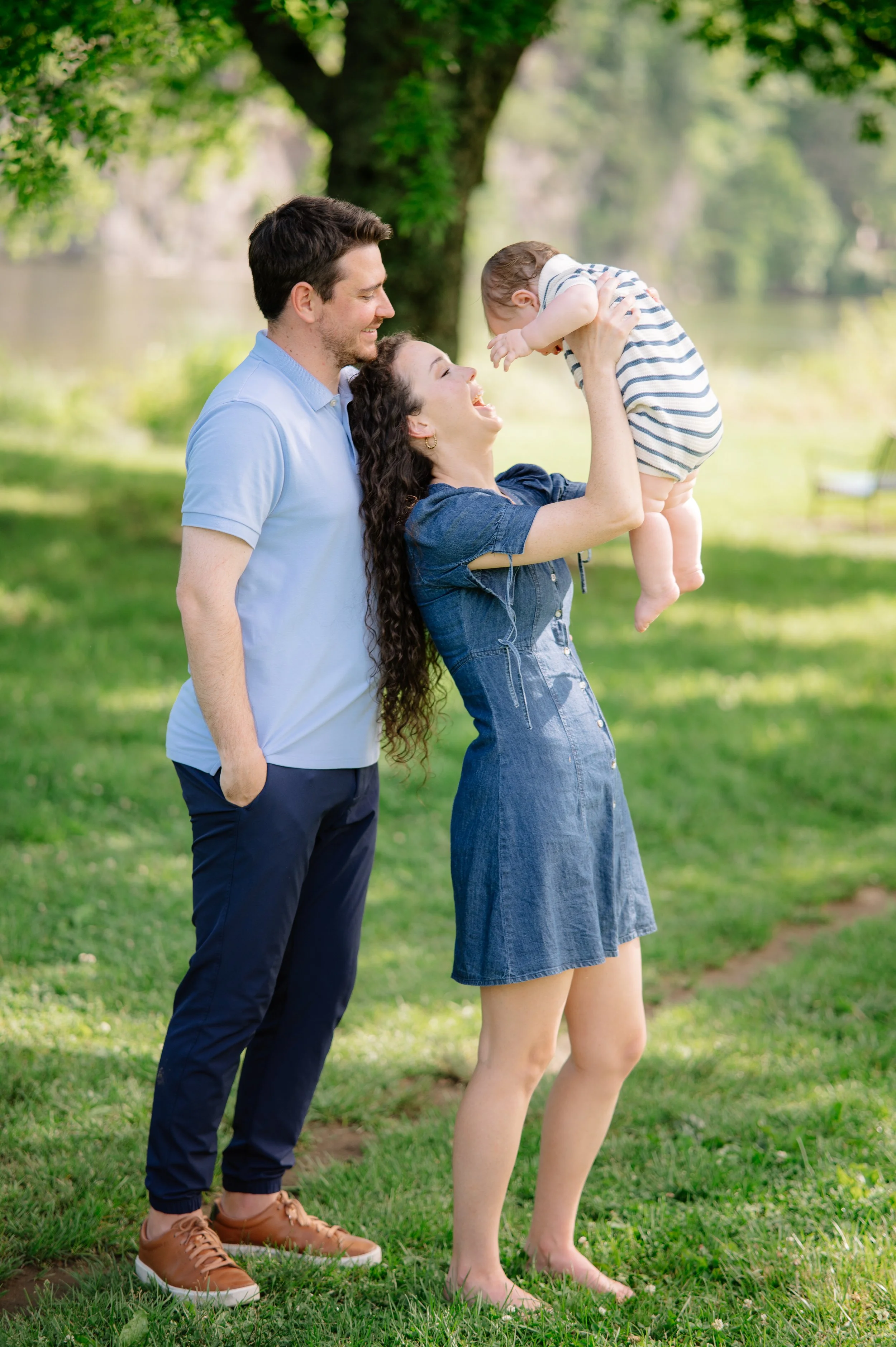 Young children playing with their parents during a lifestyle family photography session in east tn