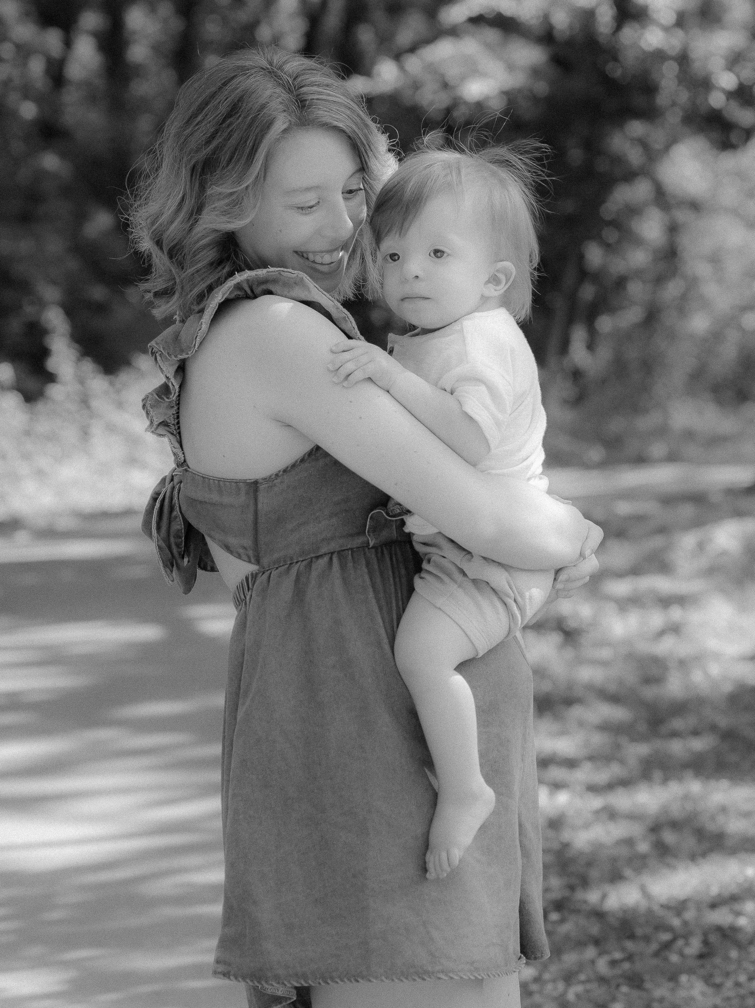 Pregnant mother posing during a maternity photo session at Sandy Springs Park in Maryville, TN.
