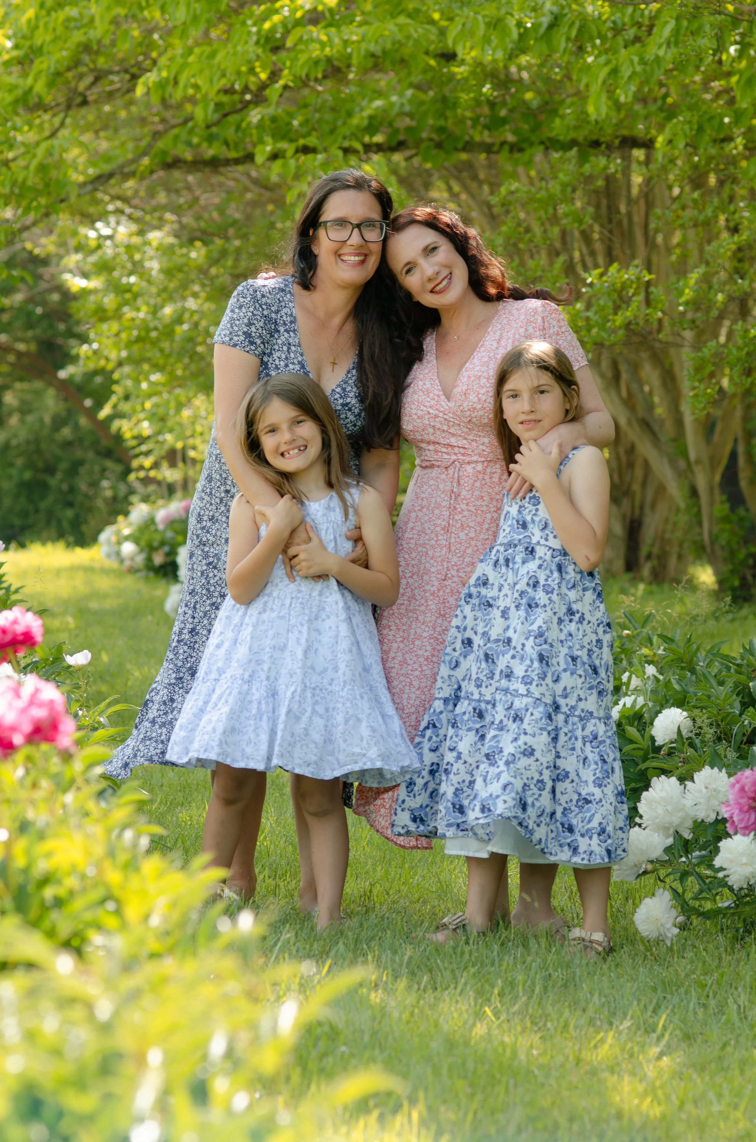 Sisters photos in Knoxville with tall trees and natural, playful connection