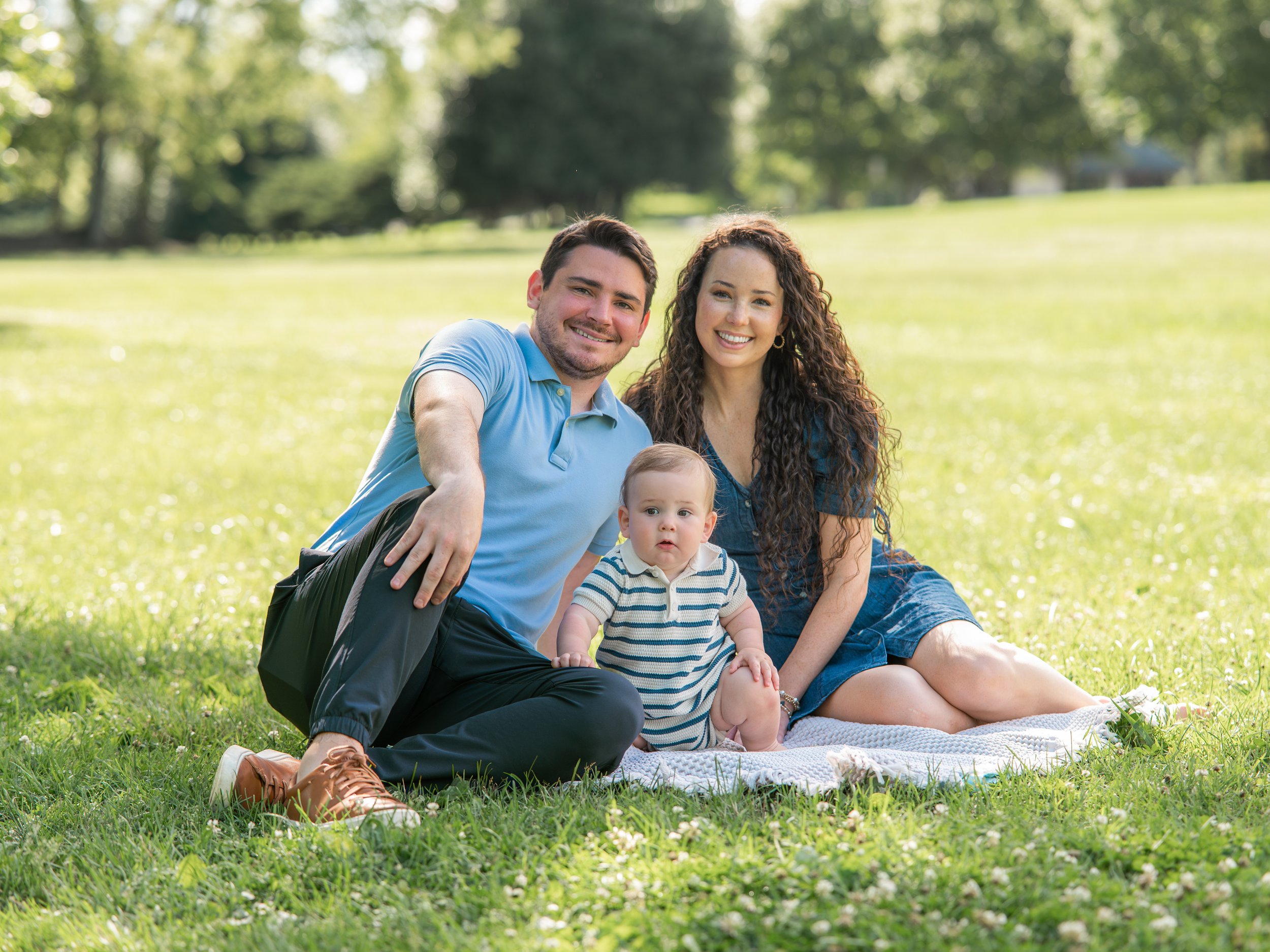 Knoxville family photographer capturing playful moments with little kids and newborn