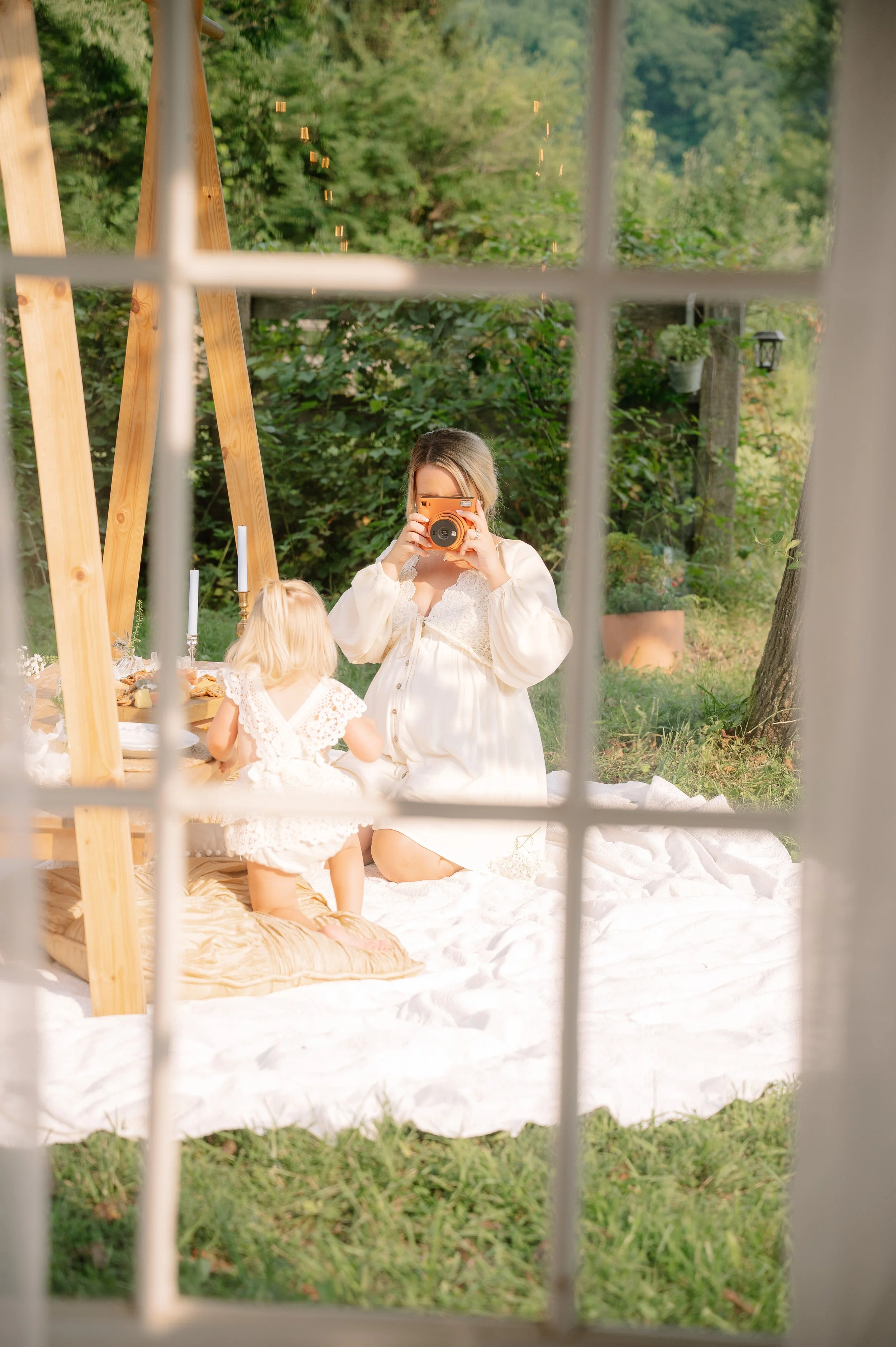 Natural in-home newborn photography featuring parents and their new baby