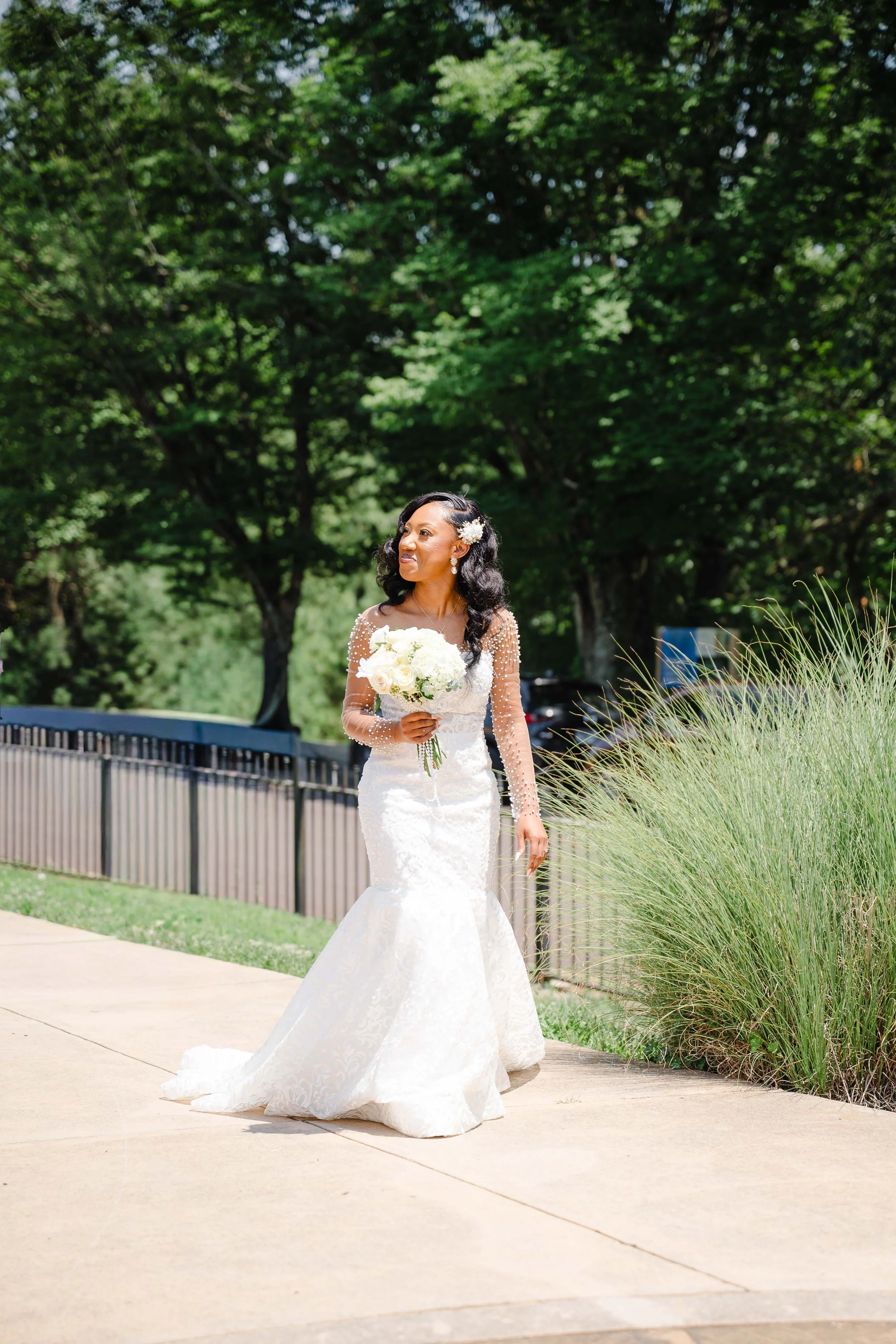 Bride walking toward the groom during an outdoor wedding ceremony in East Tennessee