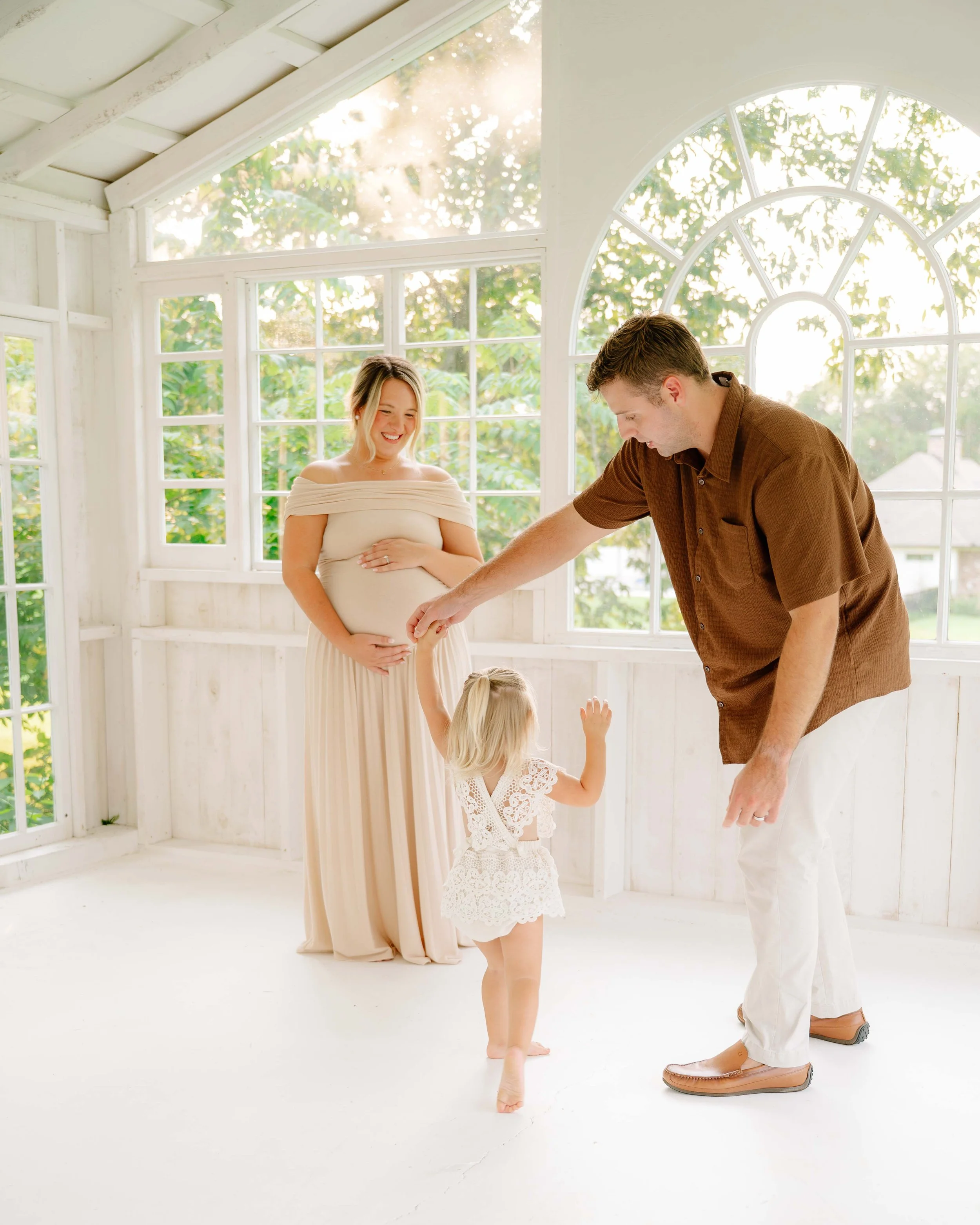 Expecting parents dancing with their toddler at The Holmstead Studio, Knoxville maternity photographer