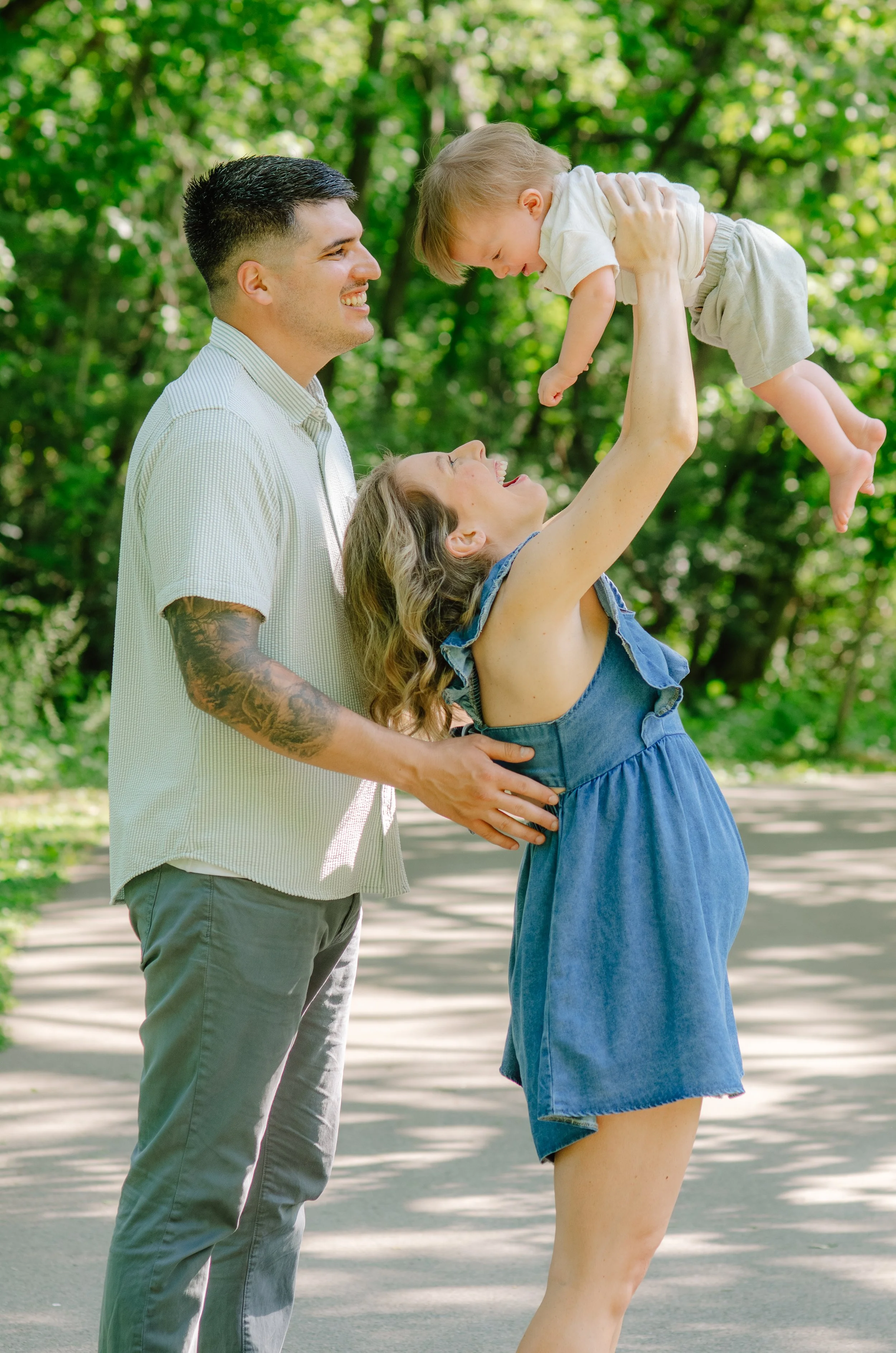 Genuine family laughter captured during a park photography session in East Tennessee