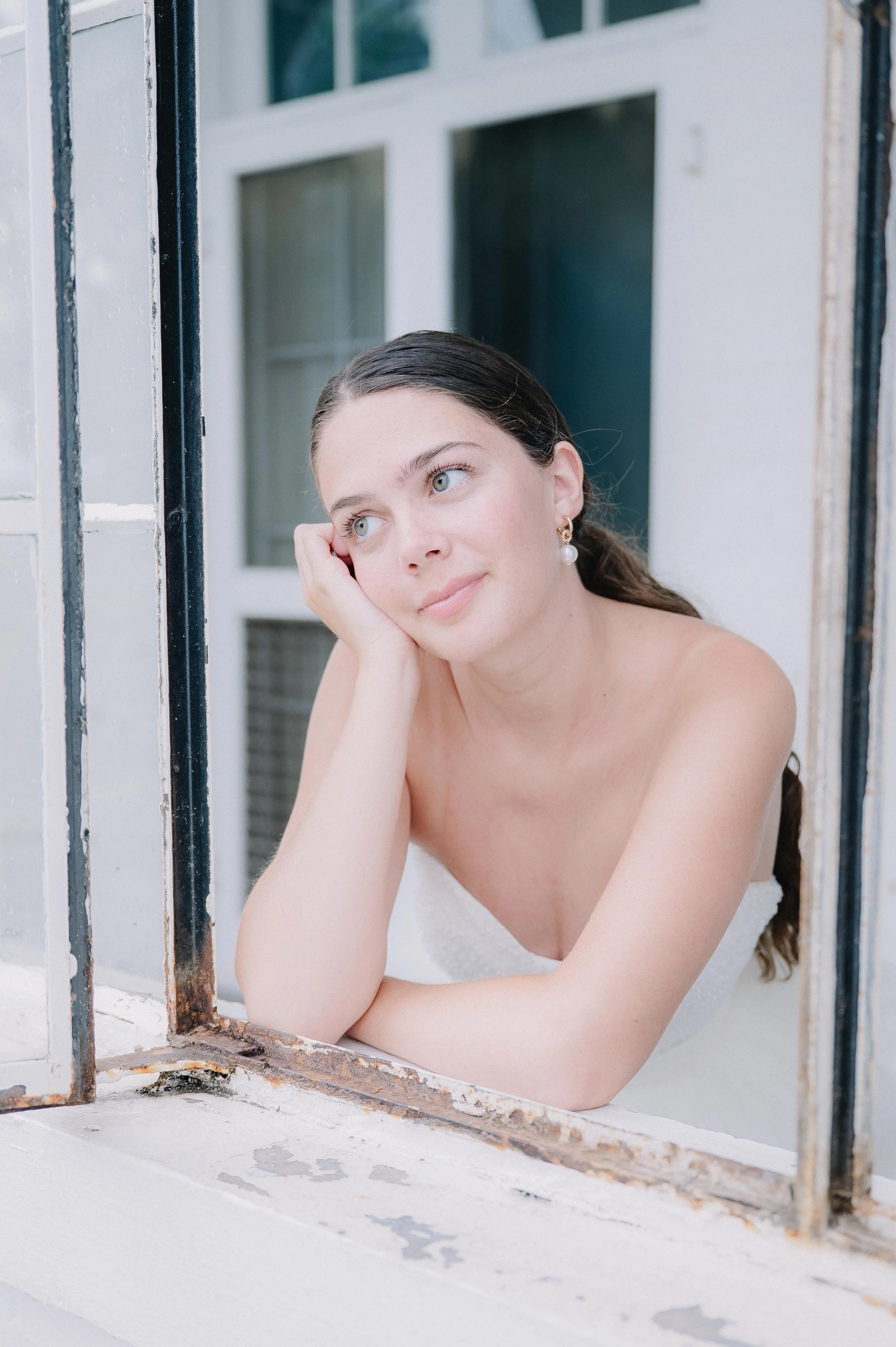 Bride Portrait with bride looking out of the window at bleak house in knoxville tennessee