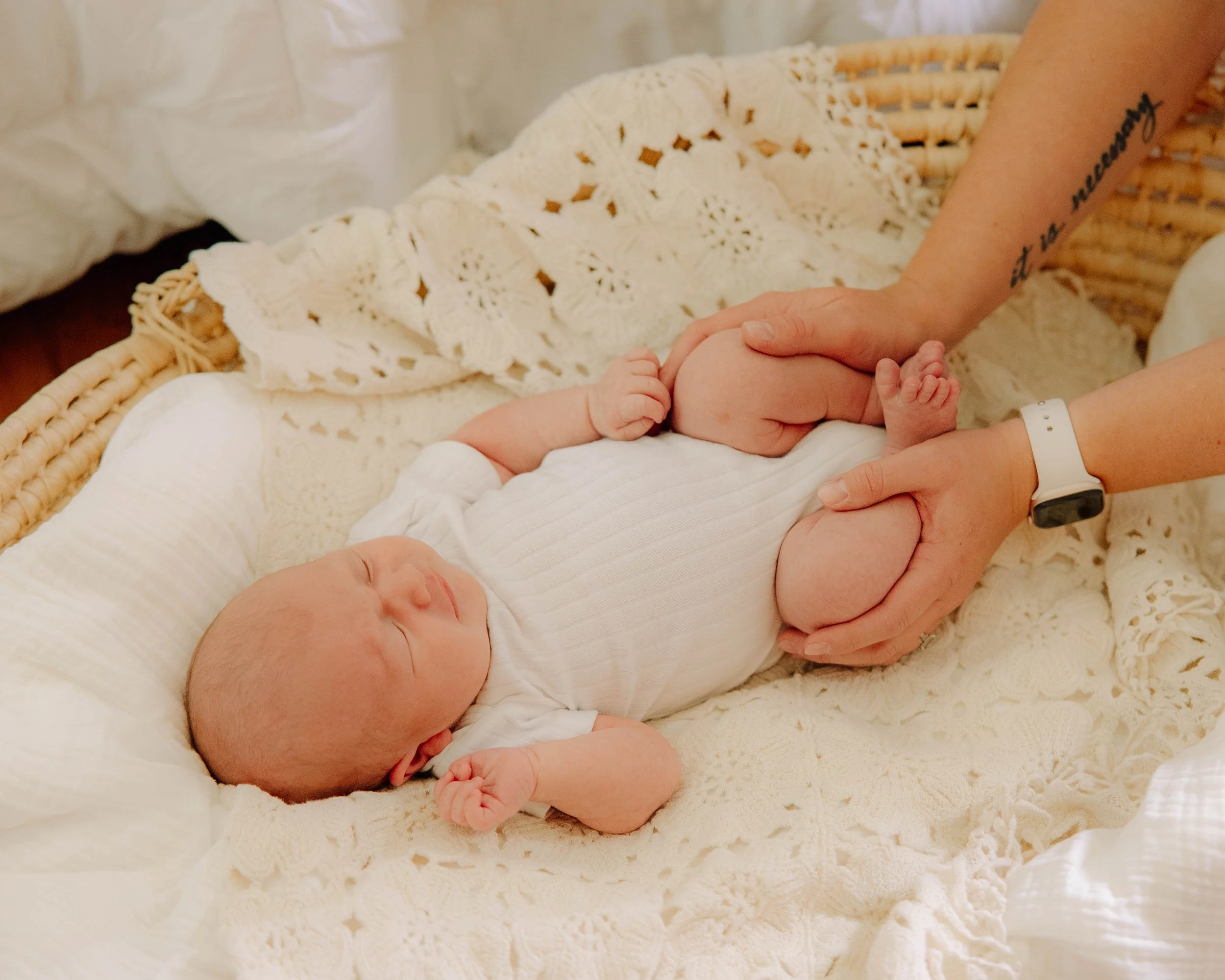 Mama holding her baby during an in home newborn session in Maryville Tn
