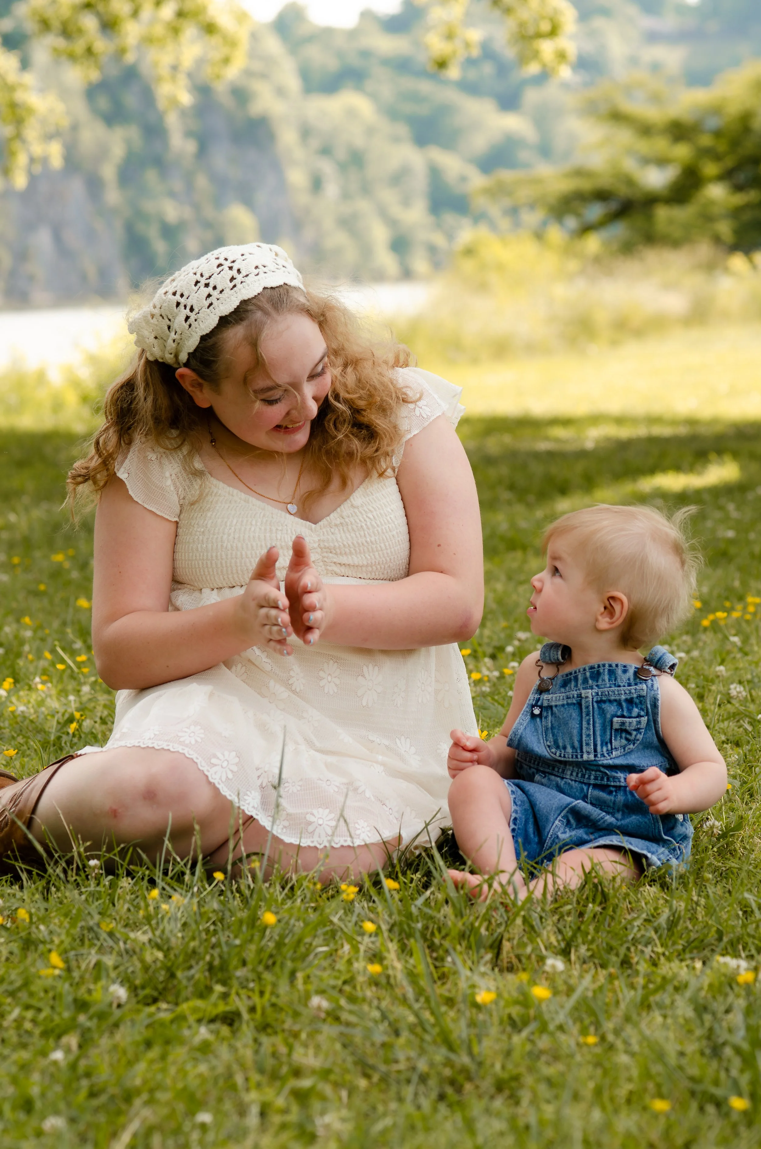 Two siblings laughing together during a family photography session near Knoxville, Tennessee.