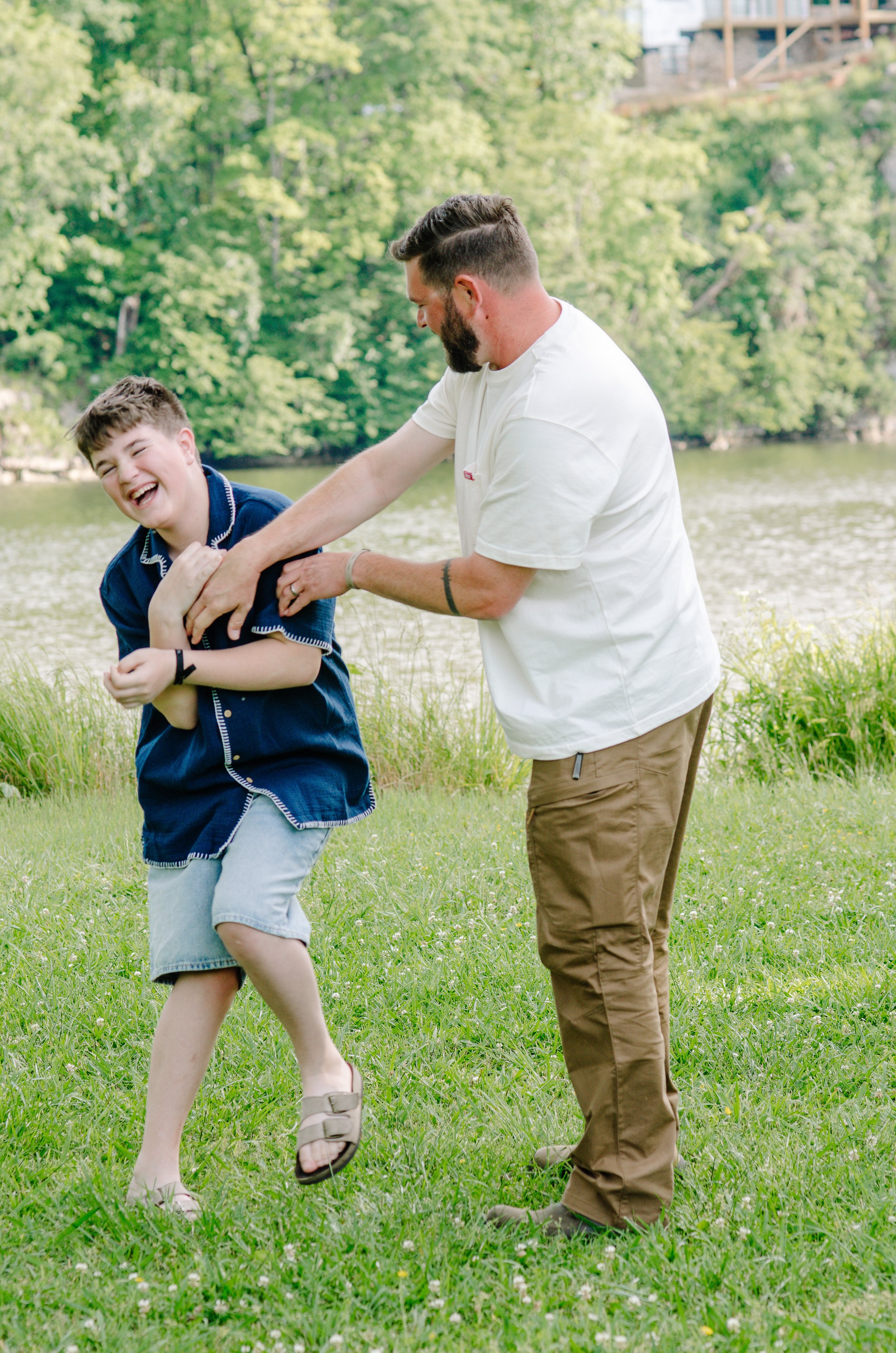 Relaxed outdoor family photography capturing genuine moments with dad ad son in Knoxville Tennessee