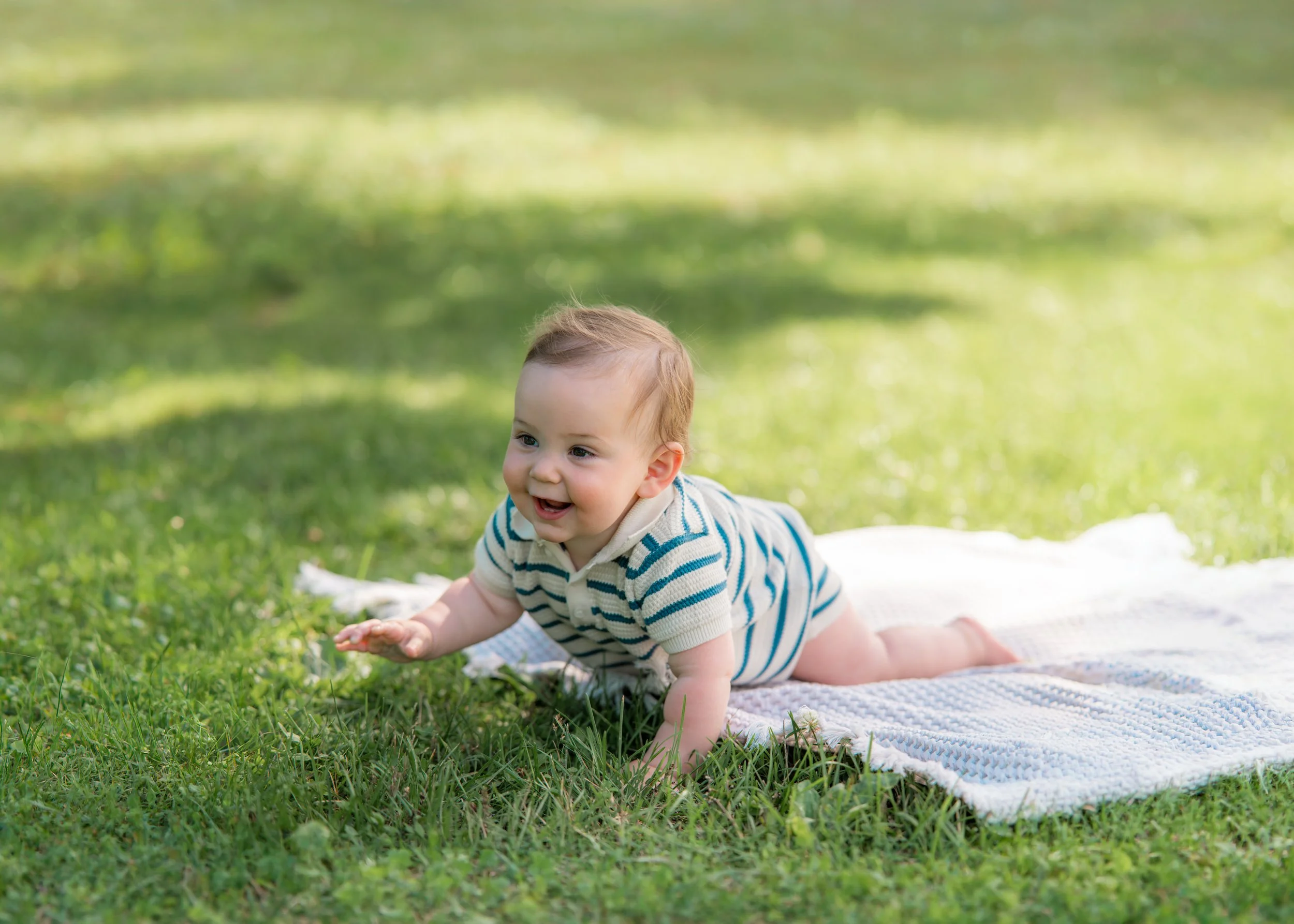Natural outdoor family portraits with playful little ones and newborn baby