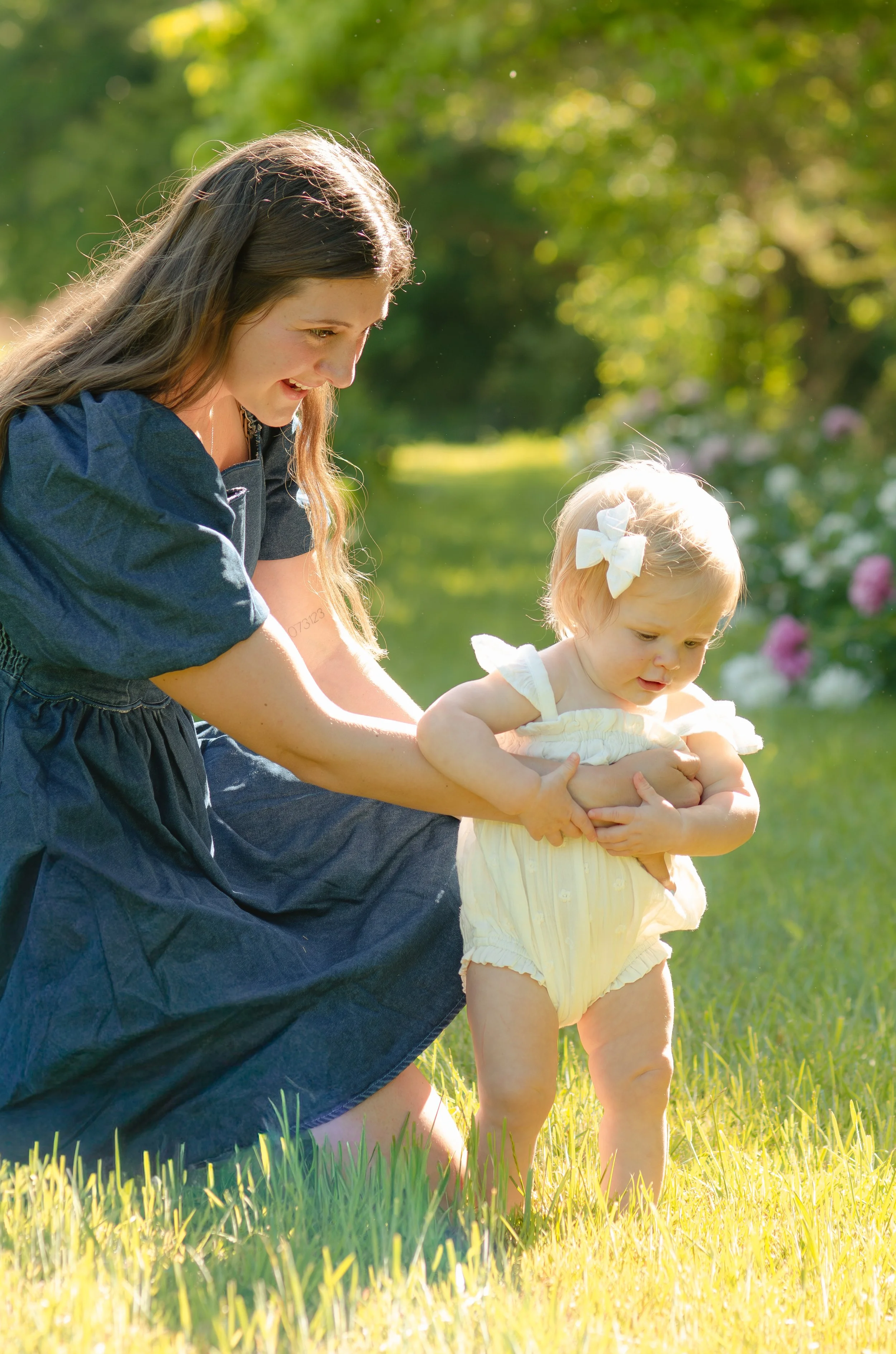 Playful mommy and me session in Knoxville with young children in outdoor setting