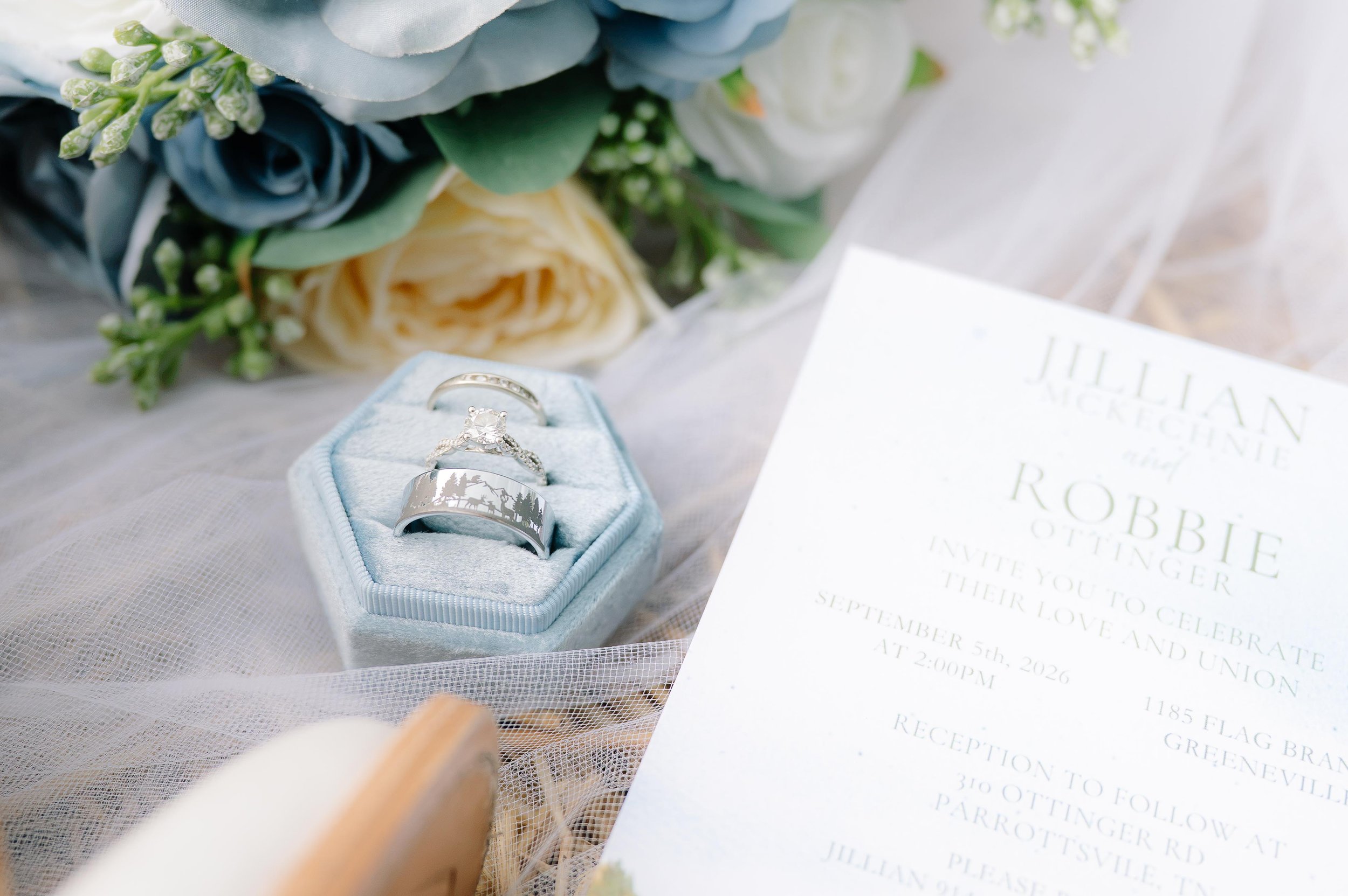 Close-ups of wedding details, wedding rings and invitation captured by a Maryville wedding photographer