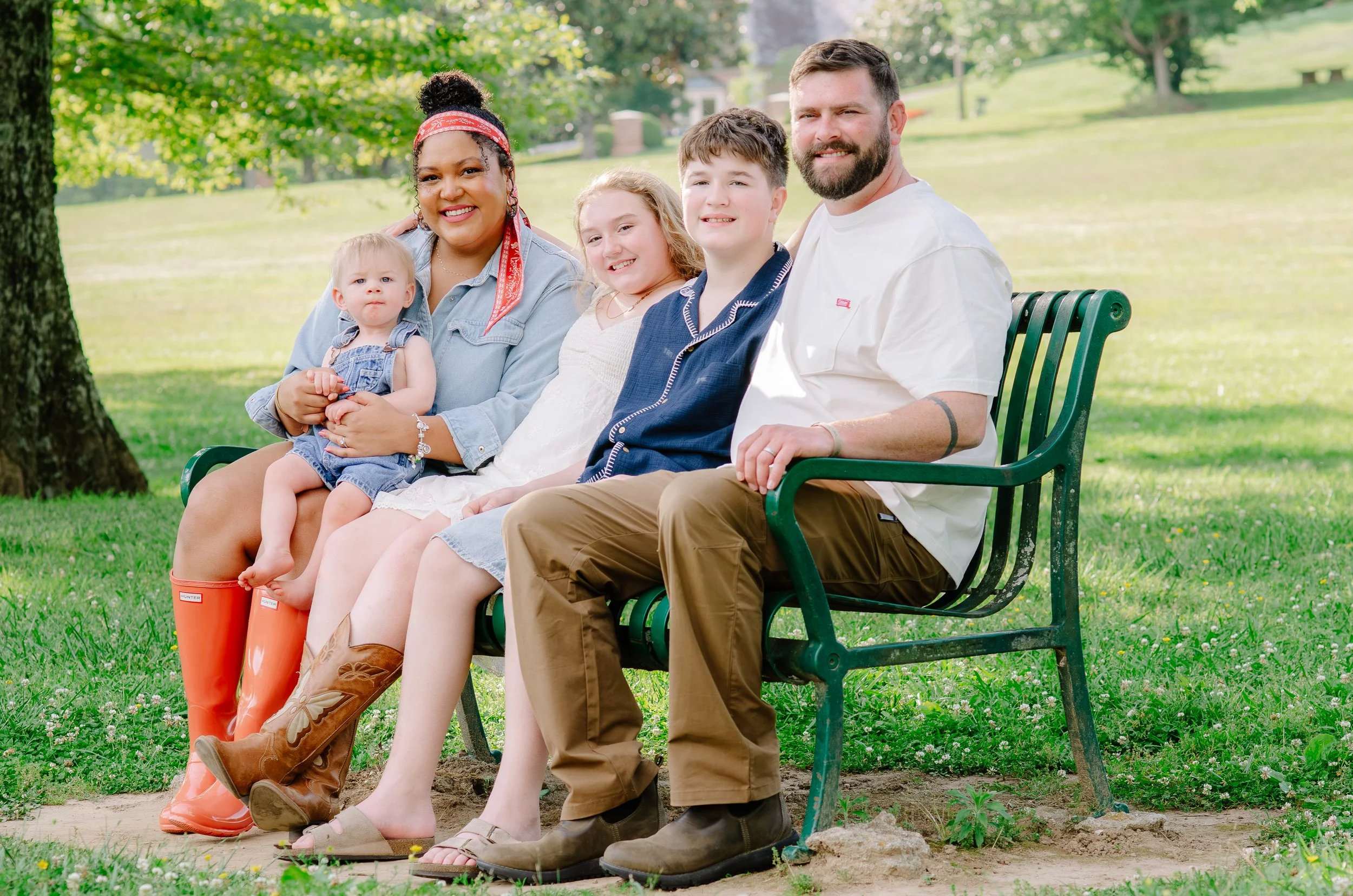 Natural outdoor family portraits with playful little ones and newborn baby