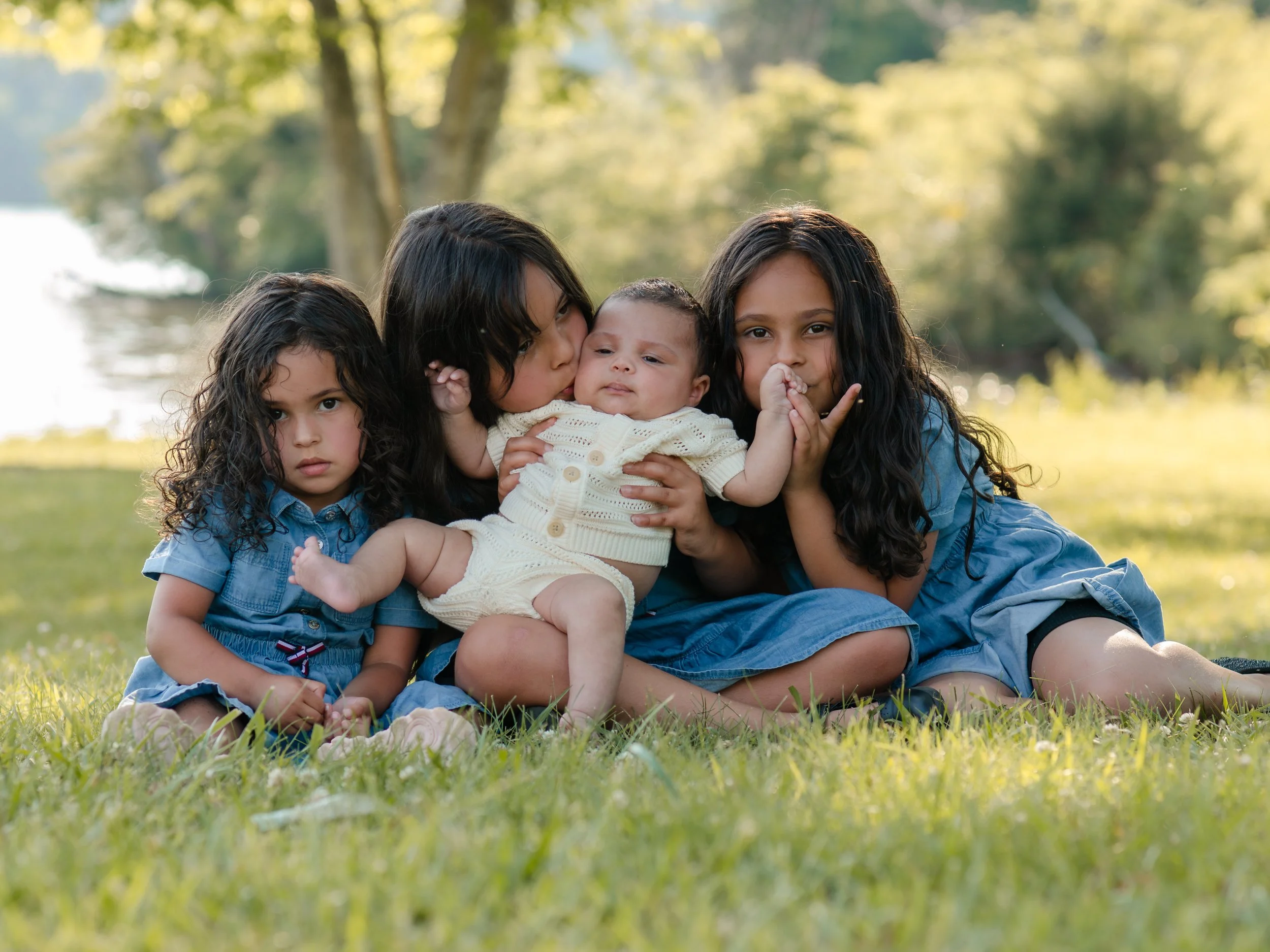 Natural outdoor family portraits with playful little ones and newborn baby