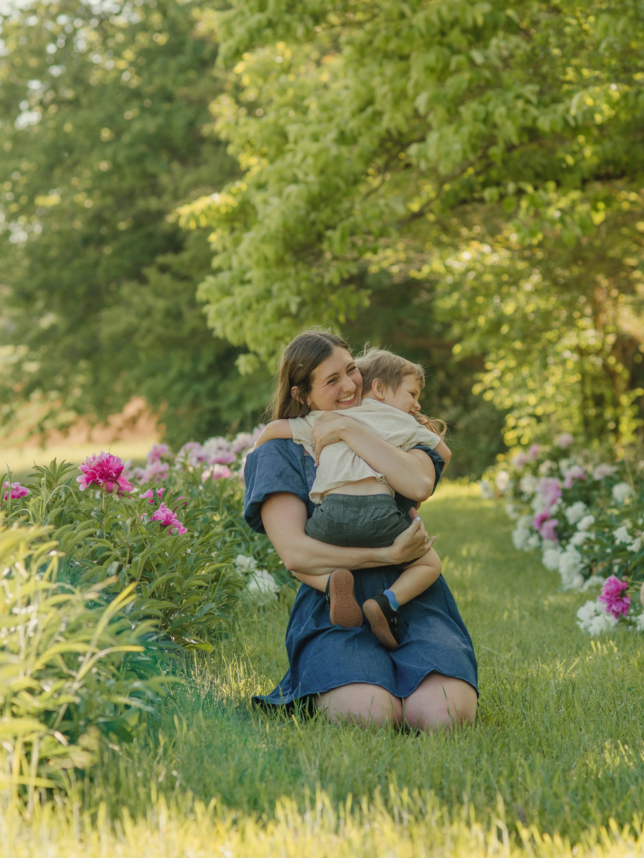 Mom and son photoshoot in Knoxville flower field with natural light and gentle tones
