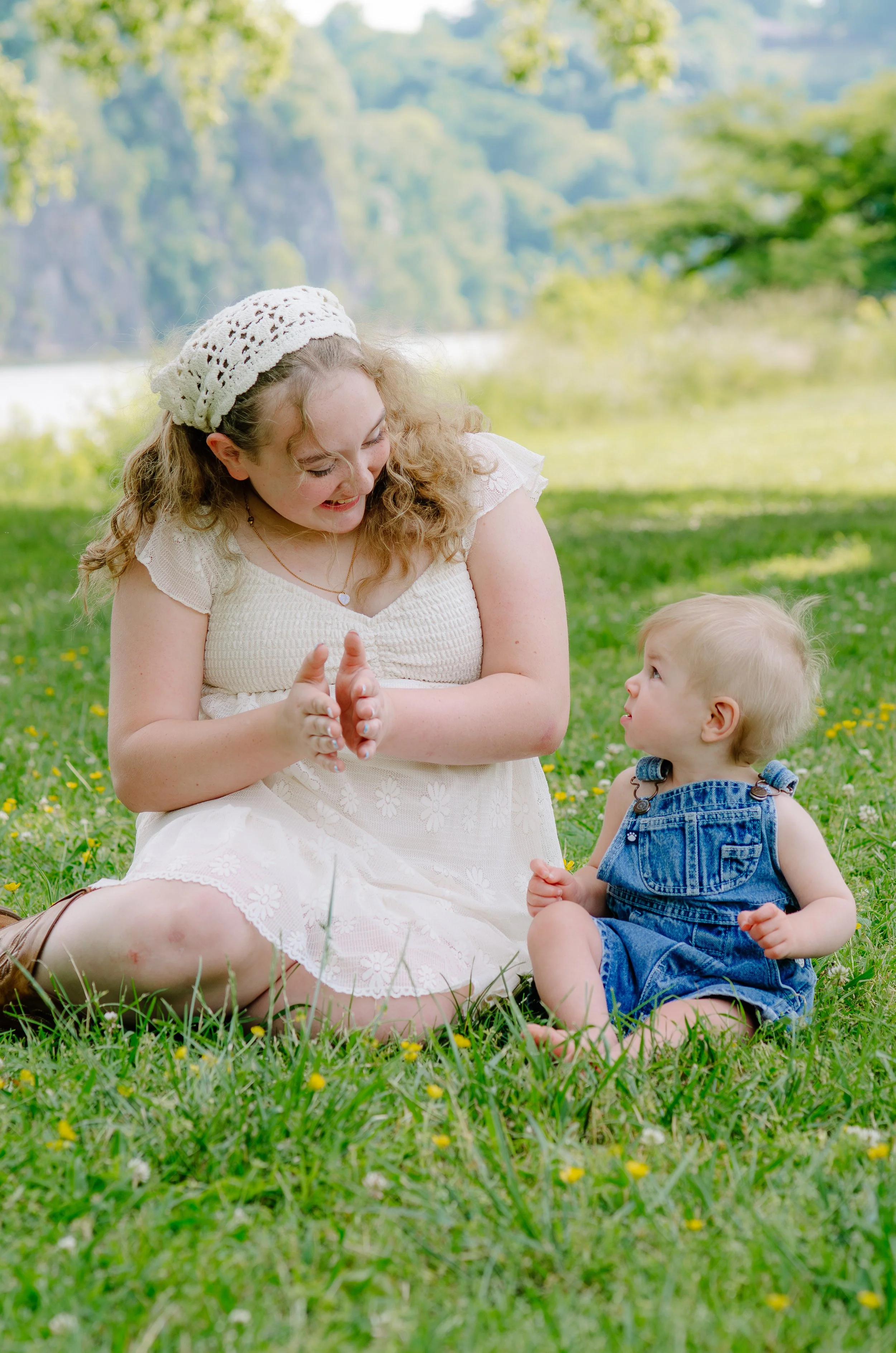 Knoxville family photographer capturing playful moments with little kids and newborn