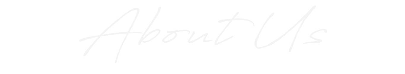Text saying 'About Us' in white cursive font on a black background.