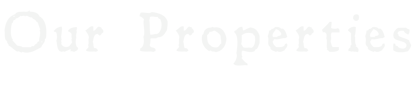 Text stating "Our Properties" with a subtitle about coastal and countryside retreats.