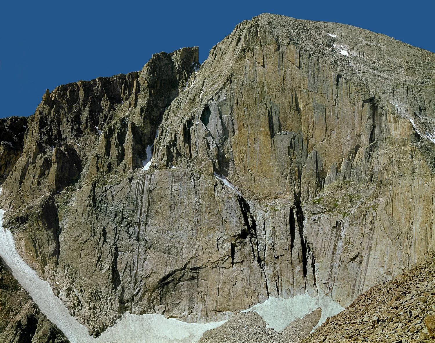 Longs Peak East Face Colorado showing the Diamond on Longs Peak with steep granite walls and snowfields in Rocky Mountain National Park