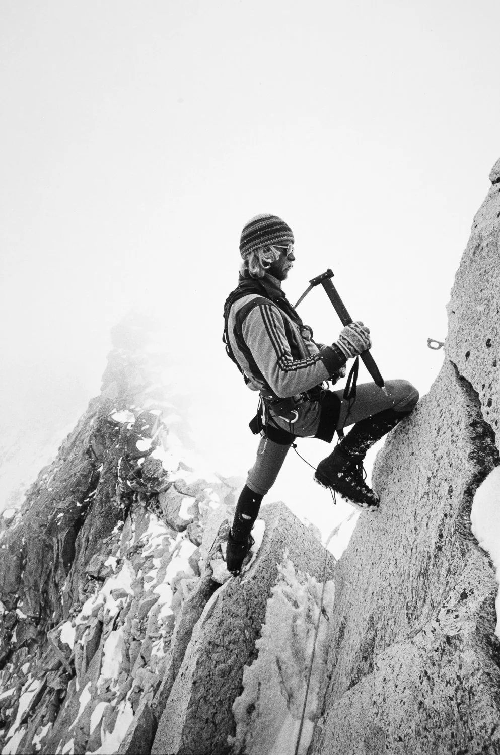 Seeking the Perfect Mix, 1979. Jeff Lowe places a piton with a prototype Hummingbird ice tool (designed by Jeff and Greg Lowe) during the first ascent of the South Ridge of Ama Dablam in the Khumbu region of Nepal. Tom Frost photo.