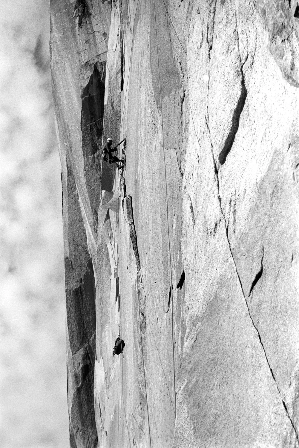 A Sea of Planes, 1964. Royal Robbins hauls a pack across the Borderline Traverse during the first ascent of the North America Wall on El Capitan, Yosemite Valley. To reach this position, Tom Frost made a dramatic “slingshot” pendulum swing from a bol