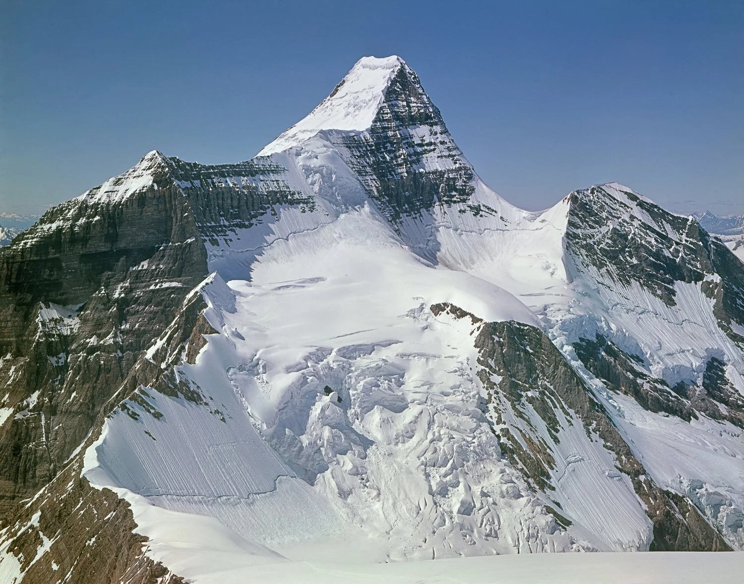 The Crown Jewel of the Canadian Rockies, 19??. The northeast face of Mt. Robson showing the route taken during the first ascent in 1913 by Conrad Kain, Albert H. MacCarthy and Basil S. Darling. After negotiating the Robson Glacier to reach a bivouac 