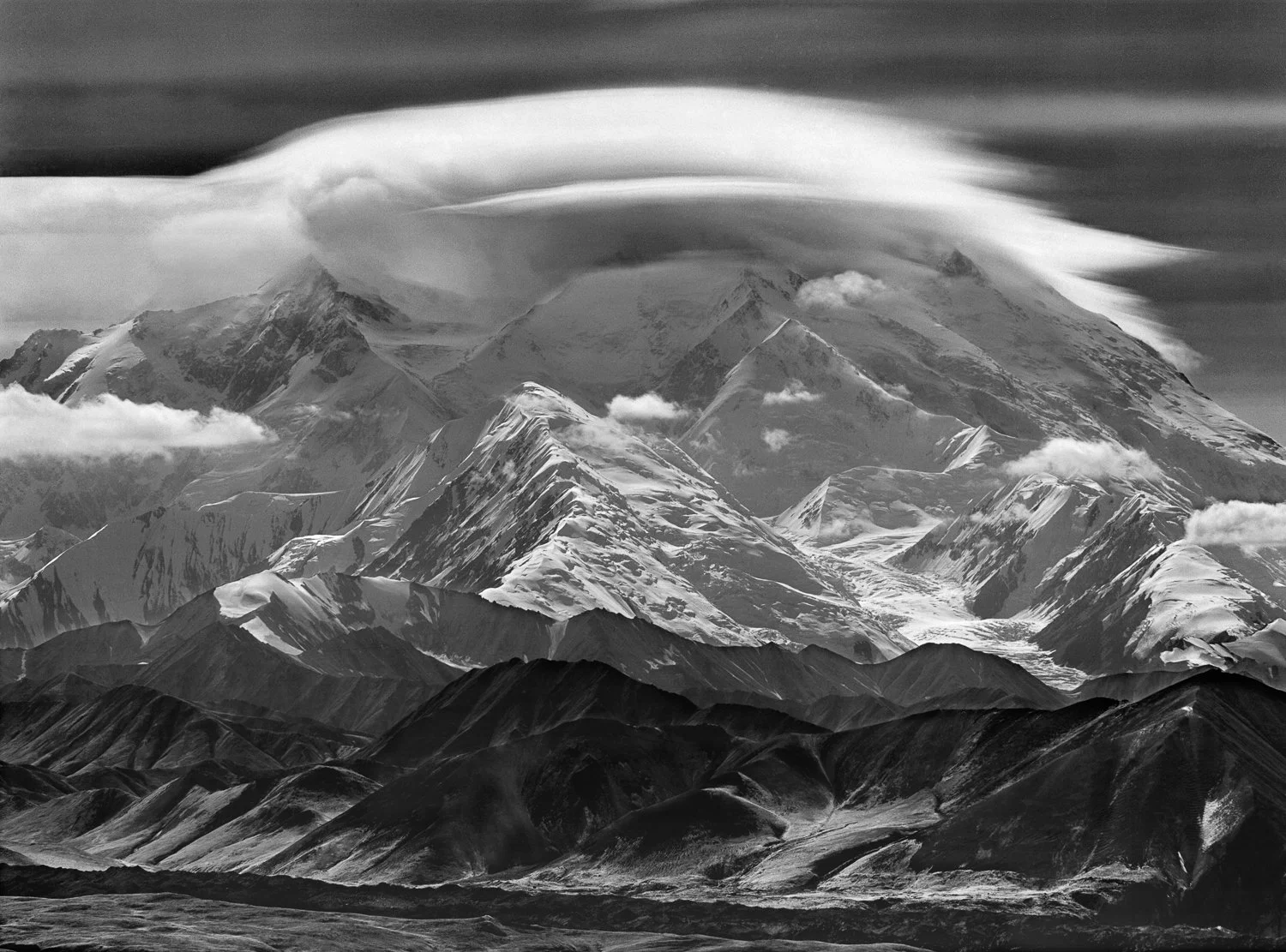 Clouds Crown The Great One, 196?. Clouds obscure the summit of Denali (20,310’), the highest peak in North America located in the remote Alaska Range and seen here from the south. Despite prior claims the higher South Summit was first climbed on June
