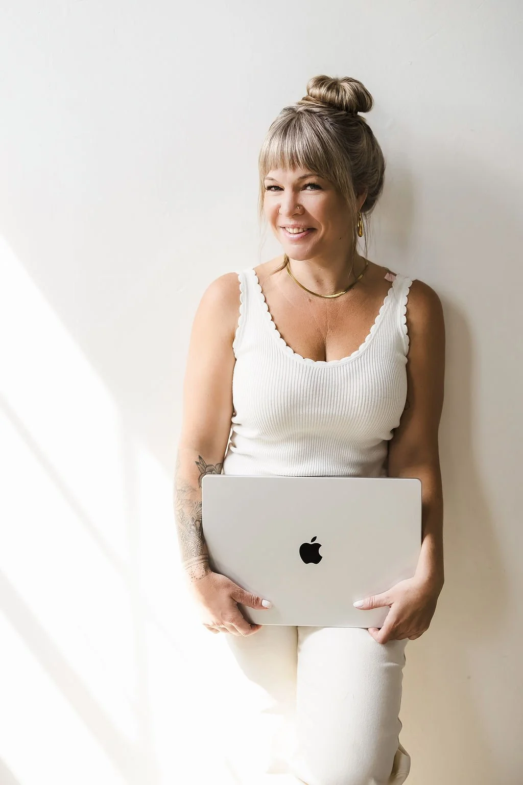 web designer holding computer