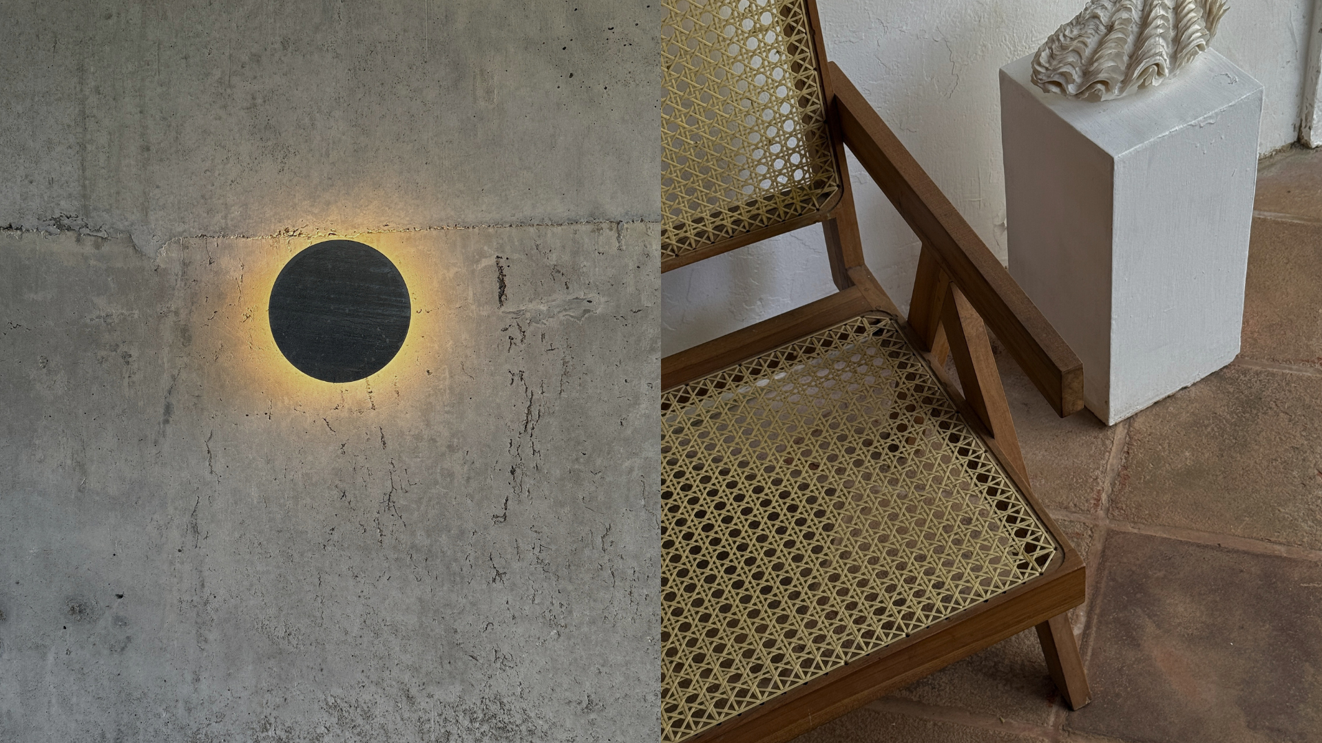 Concrete wall with circular light; wooden chair and shell sculpture