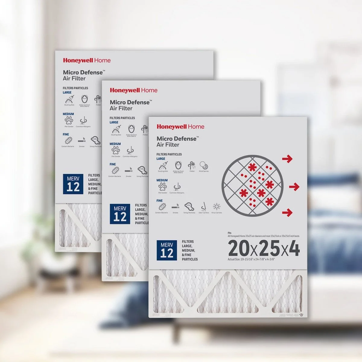 Three boxes of Honeywell Micro Defense air filters with technical specifications and illustrations on the packaging, set against a blurred indoor background.