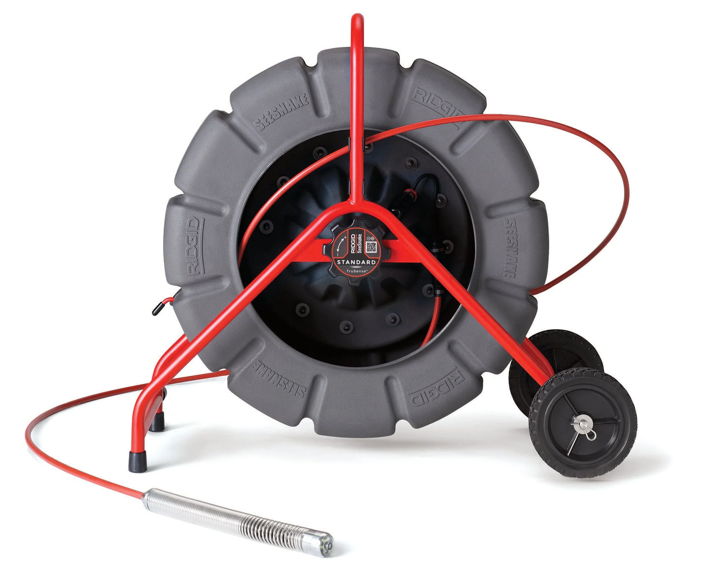 A large red and gray sewer camera for pipe inspection with a coiled black and red hose attached and black wheels.