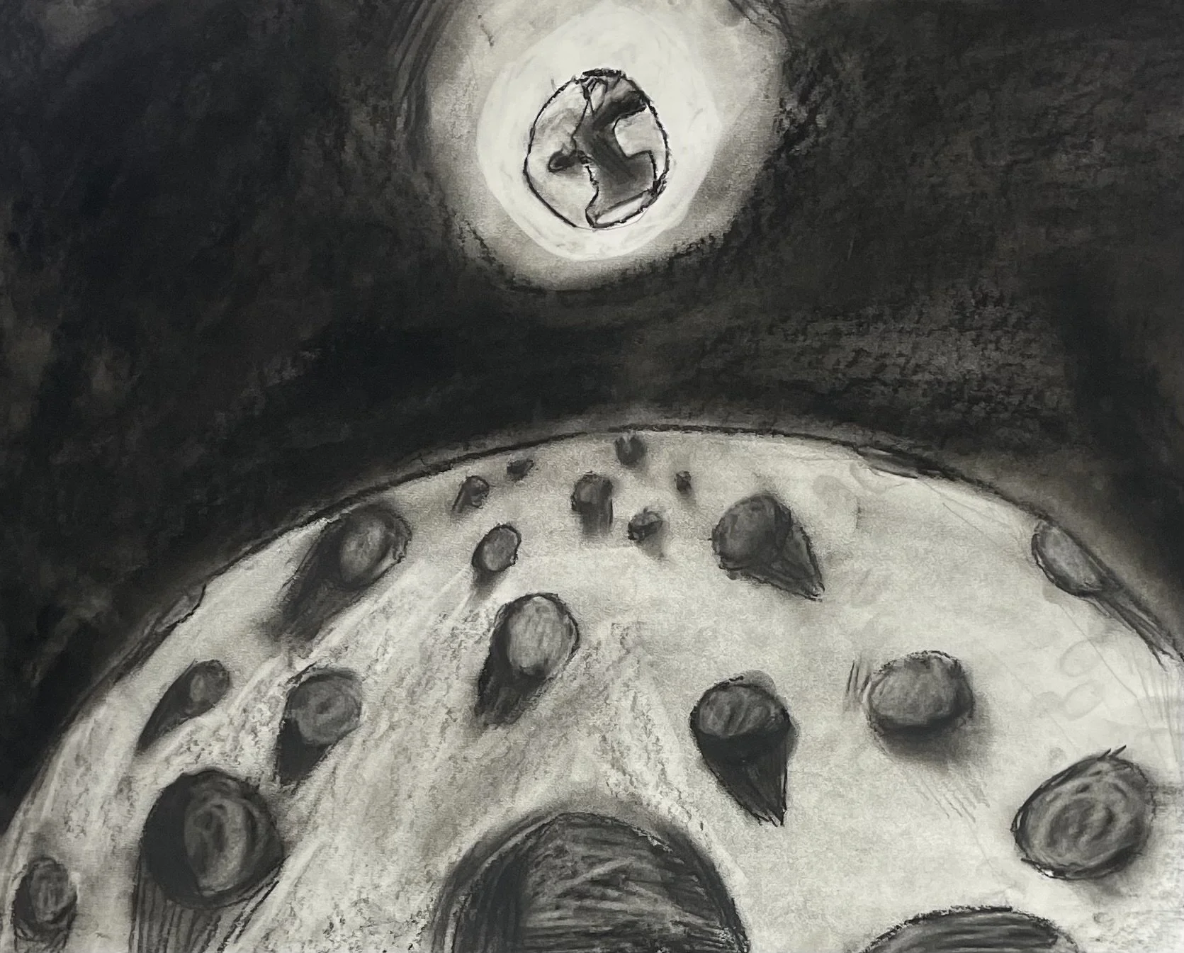 The Moon:

Stylized charcoal drawing of the moon

