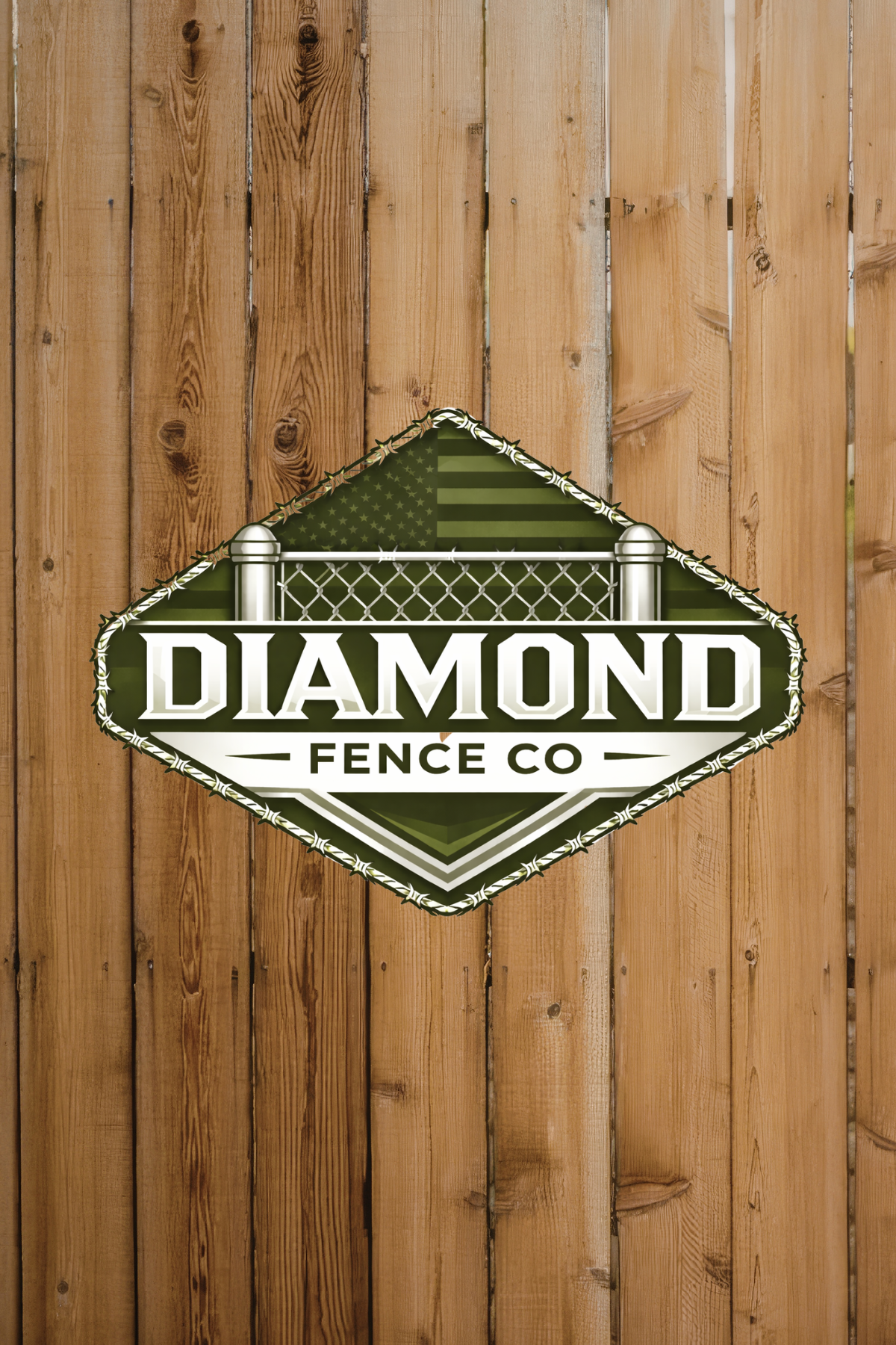 Logo for Diamond Fence Co on a wooden background, featuring a green diamond shape with a fence illustration and the company name.