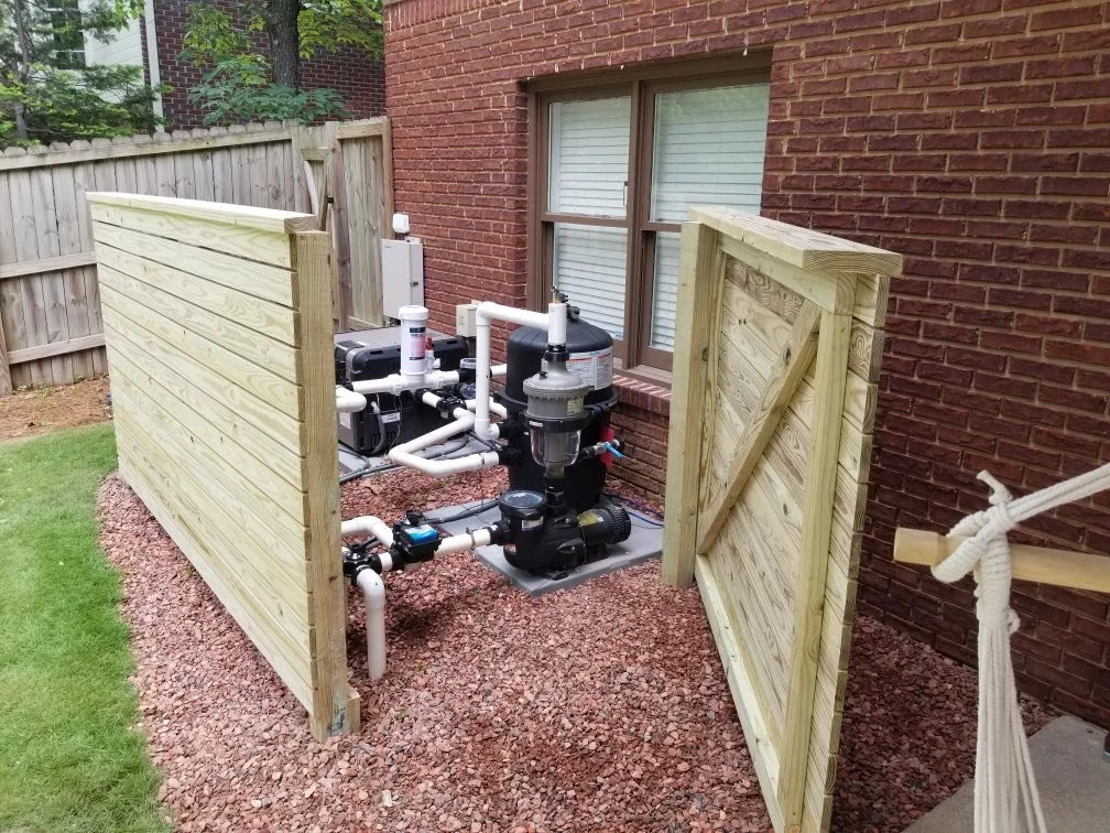 Wood gate enclosure installation.