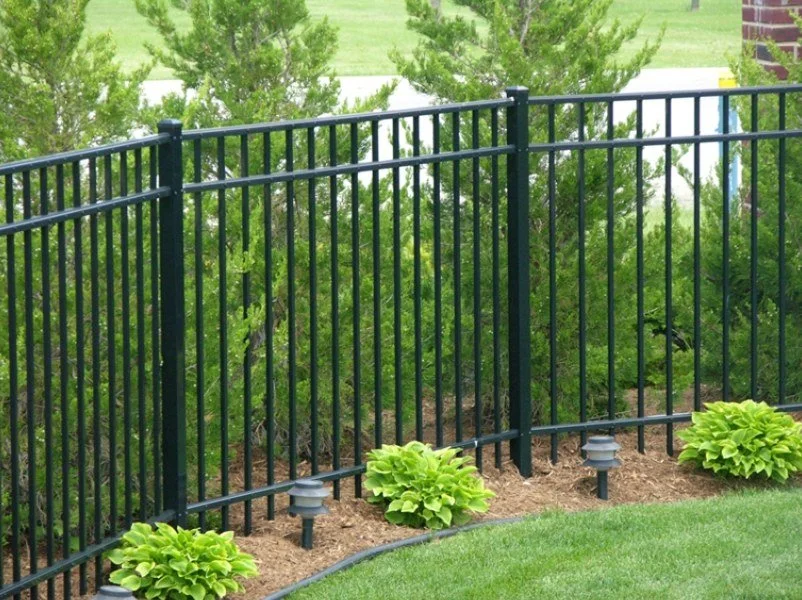 A flat top 3 rail black aluminum fence