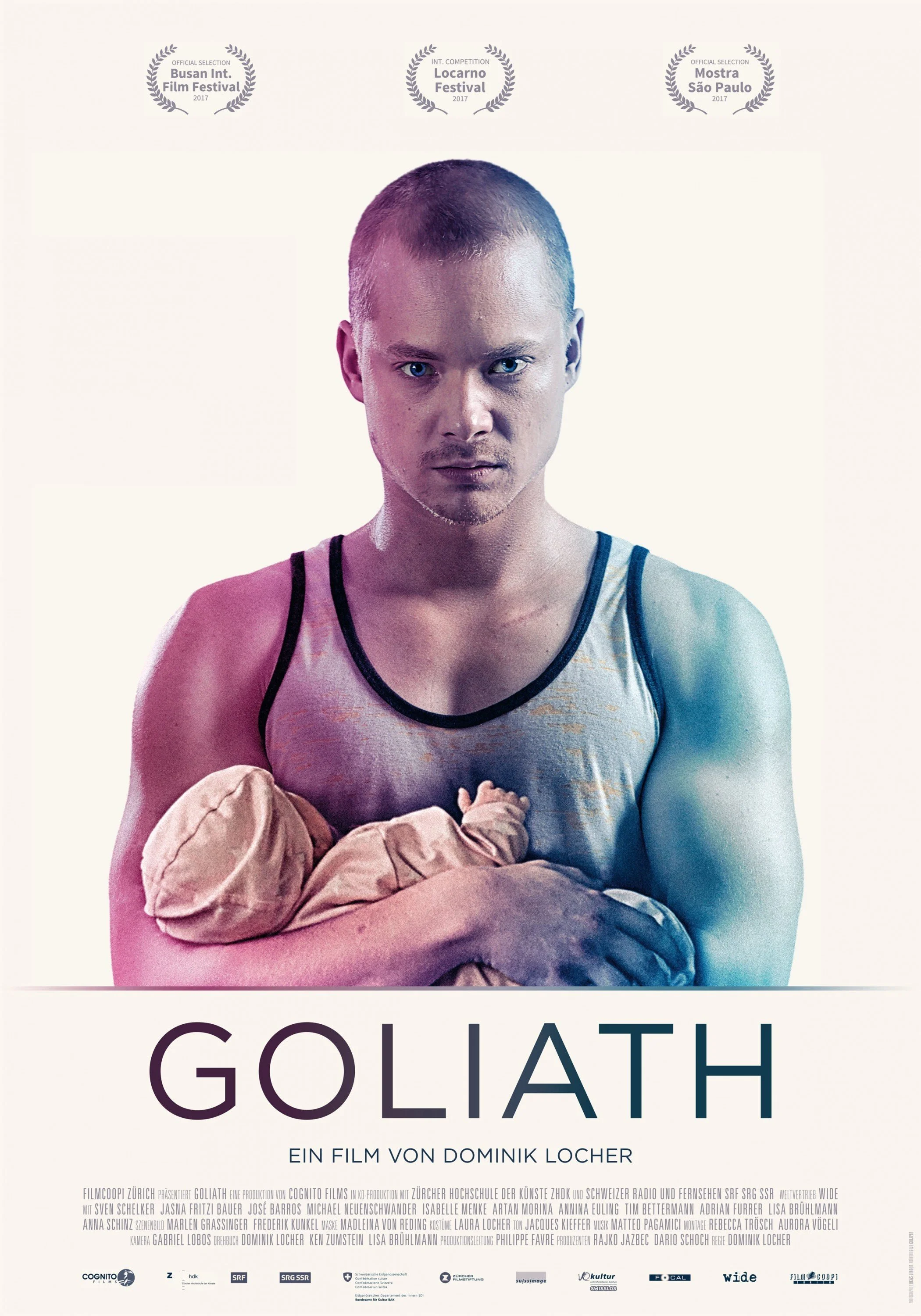 A promotional poster for the film 'Goliath' featuring a young man with closely cropped hair and intense blue eyes, holding a pair of brown boxing gloves. The background is plain white, with official selection laurels from film festivals at the top an