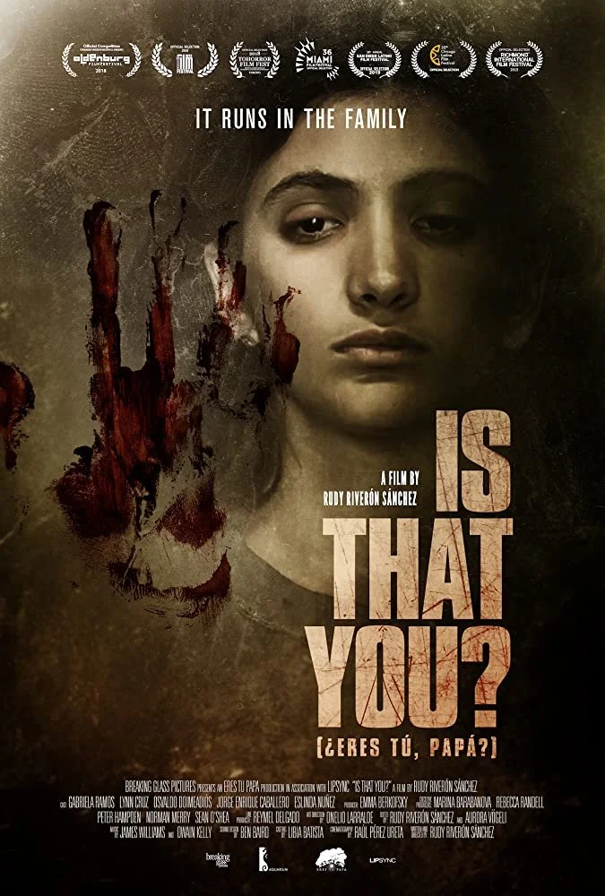 Movie poster for 'Is That You?', showing a young woman's face with a large bloodstained handprint to her left. The poster includes film festival laurels and awards at the top, with the tagline 'It Runs in the Family' above her face. The title appears