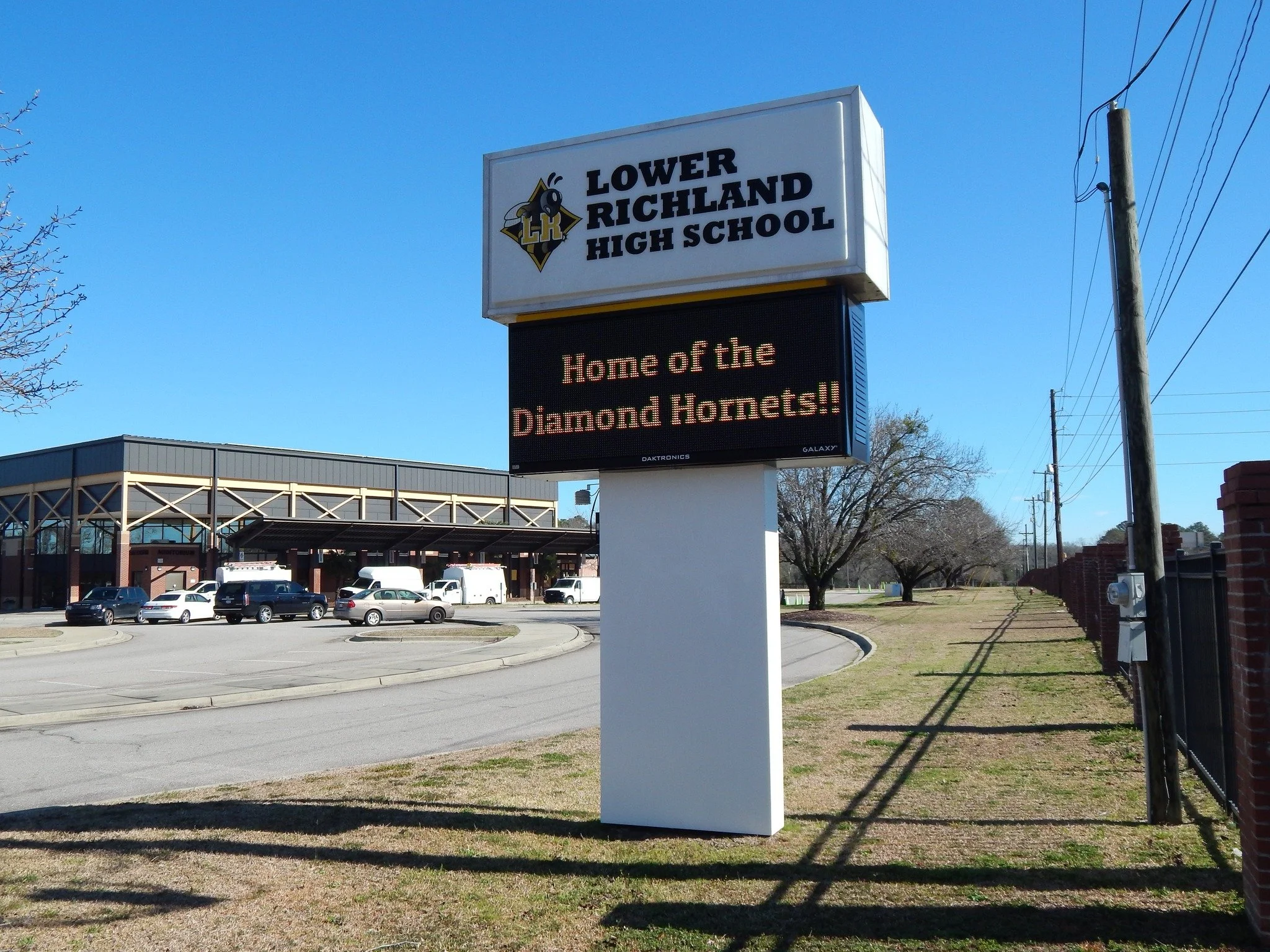 Sign for Lower Richland High School with electronic message board below displaying 'Home of the Diamond Hornets!'