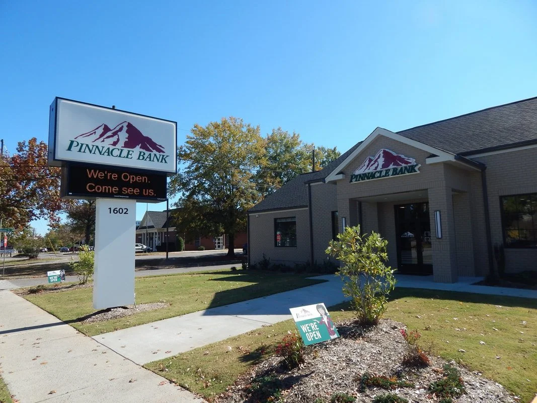 Pinnacle Bank branch with sign indicating it is open.