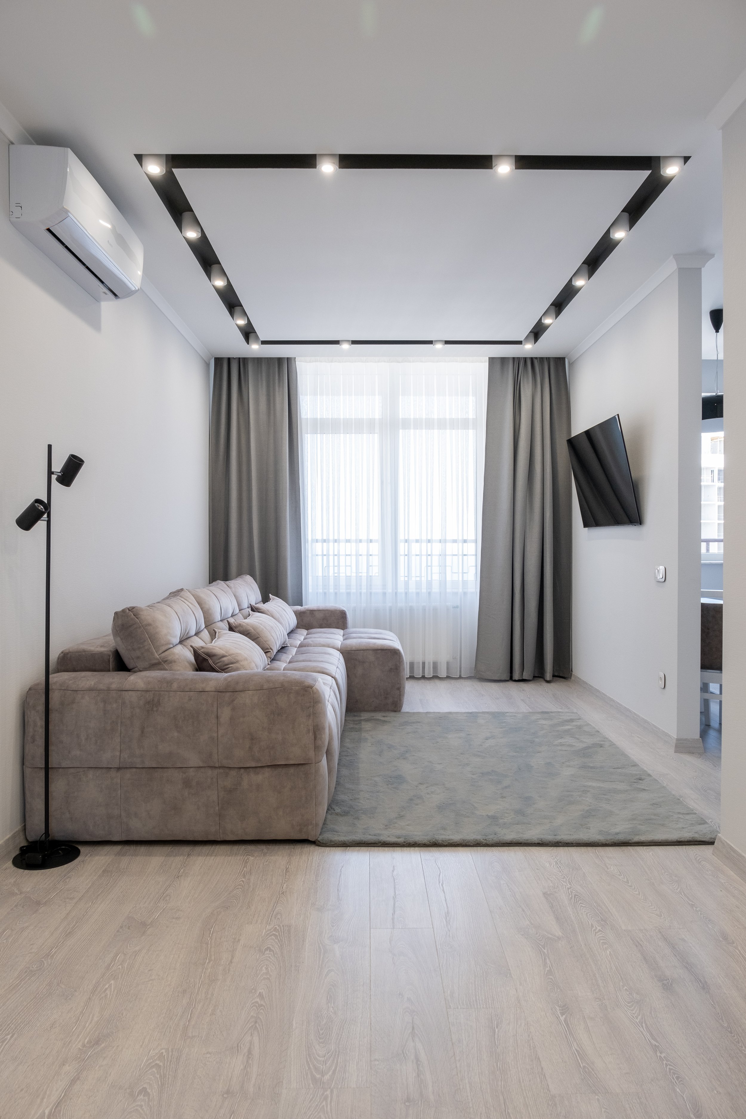 Interior photography of modern living room, natural light, neutral tones, real estate photography Niagara