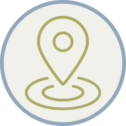 An icon of a location pin with a light background and a blue and gray circular border
