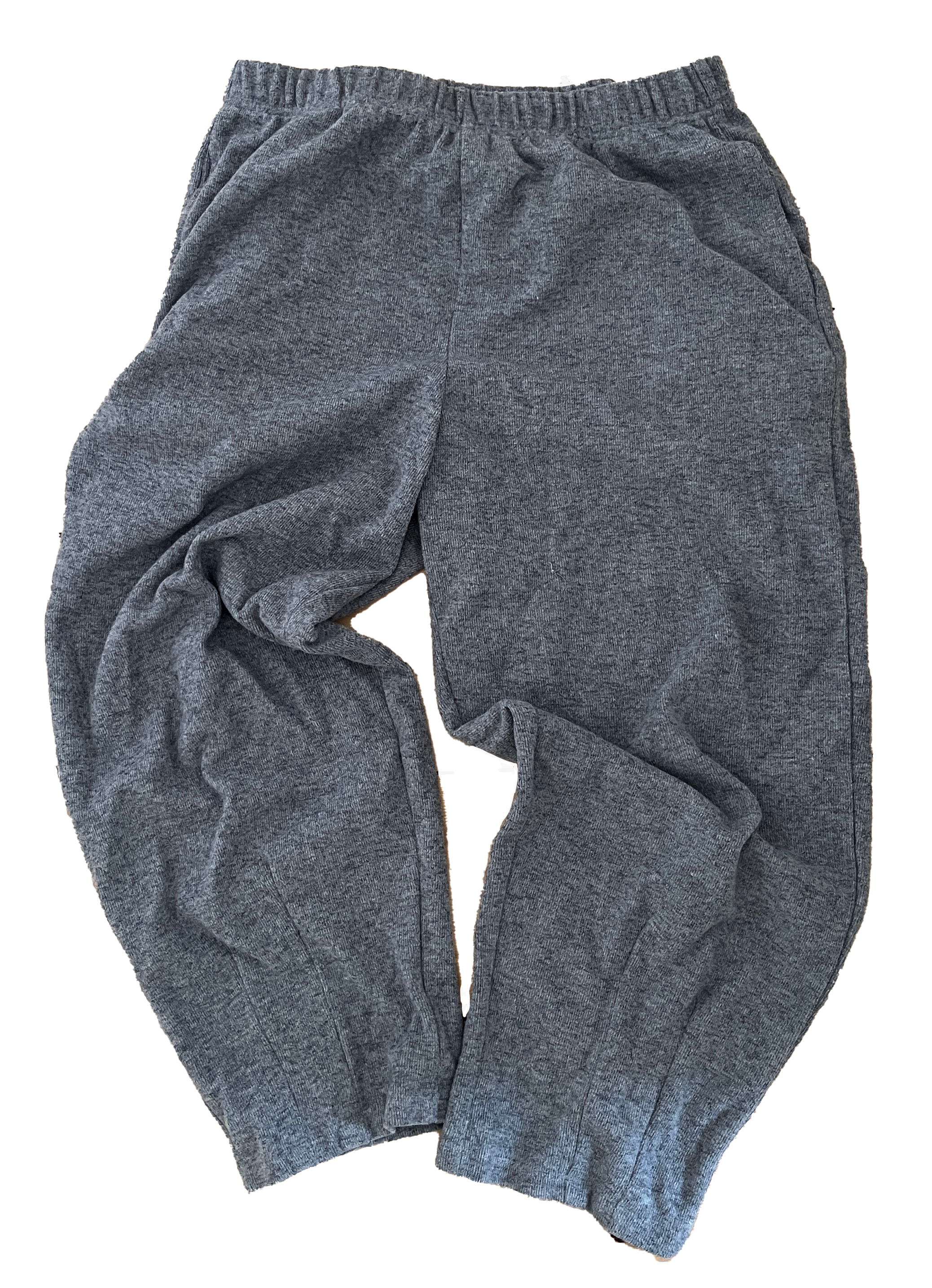 Gray athletic sweatpants with an elastic waistband and side pockets, laid out on a flat surface.