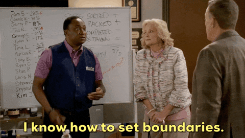 GIF of a man moving his hands in a circle in front of him and saying "I know how to set boundaries." He is talking to another man and a woman.