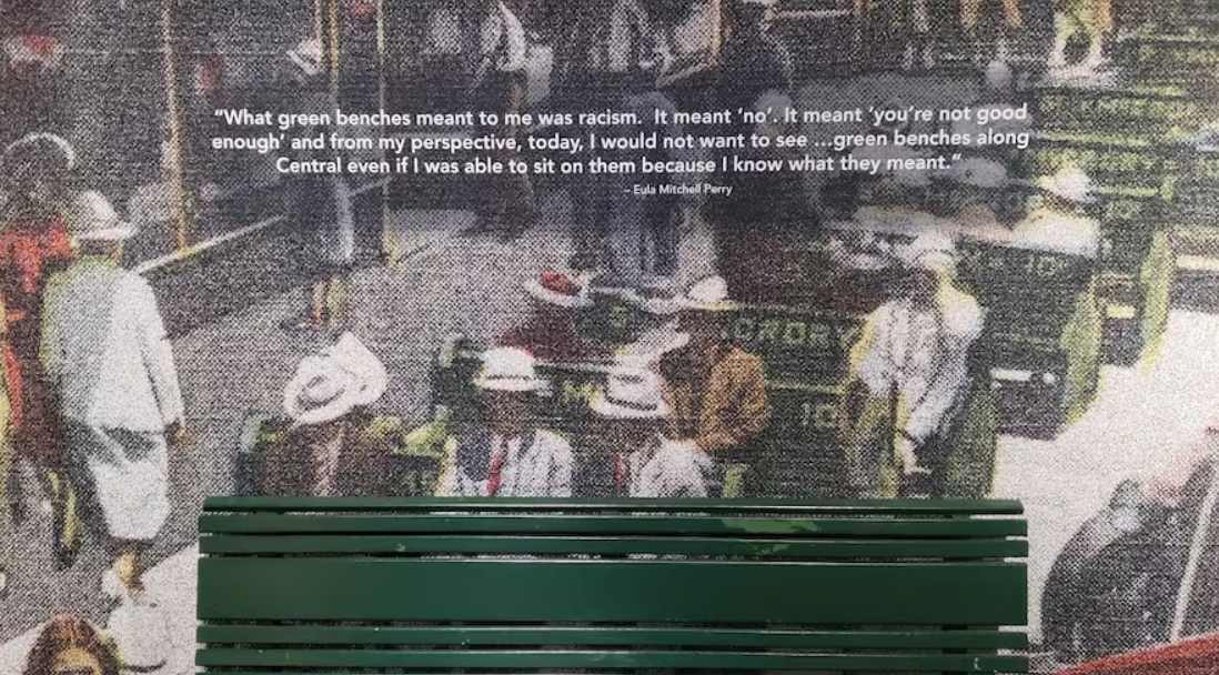 Image of a green bench in the Florida Holocaust Museum exhibit "Beaches, Benches, and Boycotts: The Civil Rights Movement in the Tampa Bay."