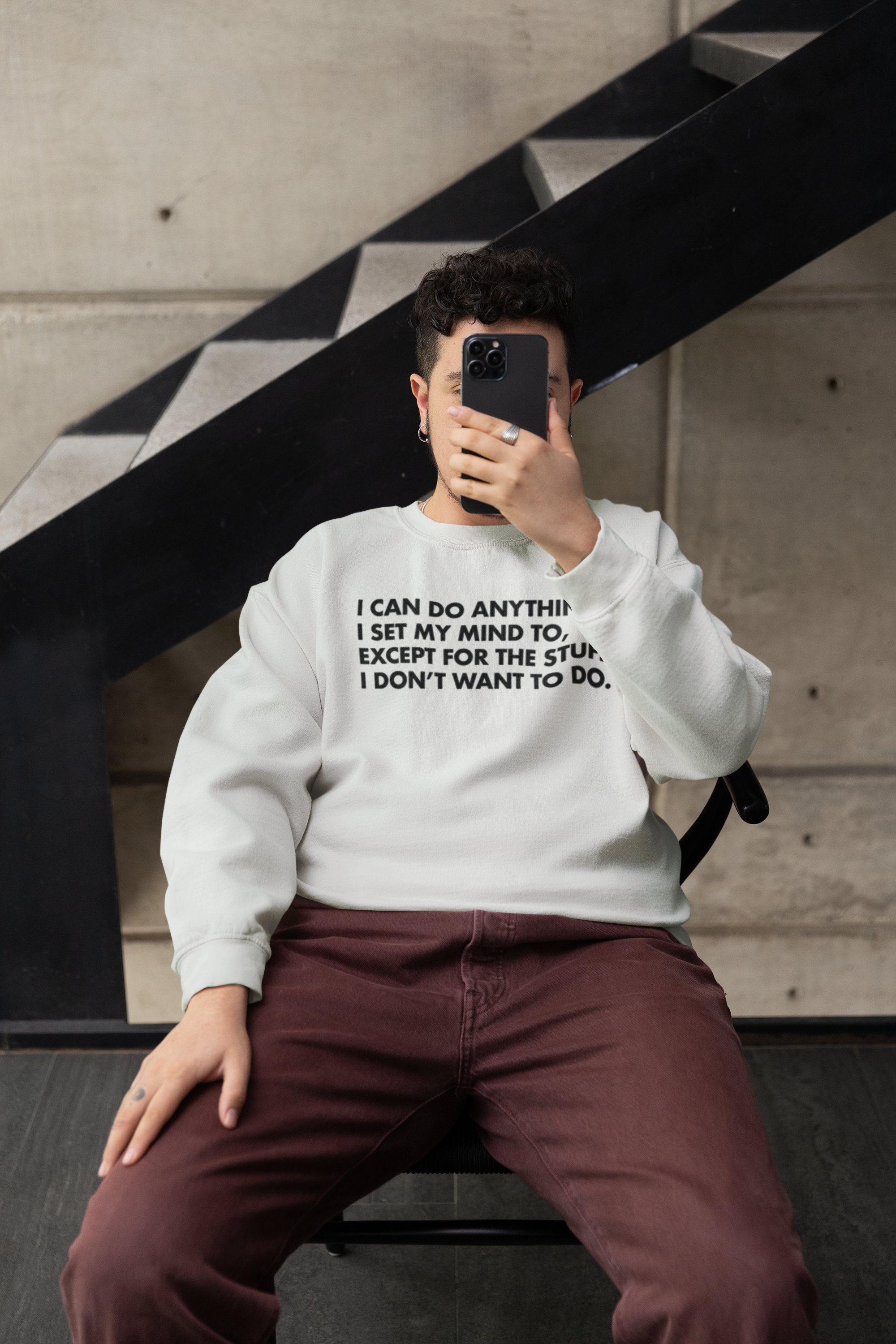 gildan-sweatshirt-mockup-featuring-a-person-posing-with-a-smartphone-m39040.png