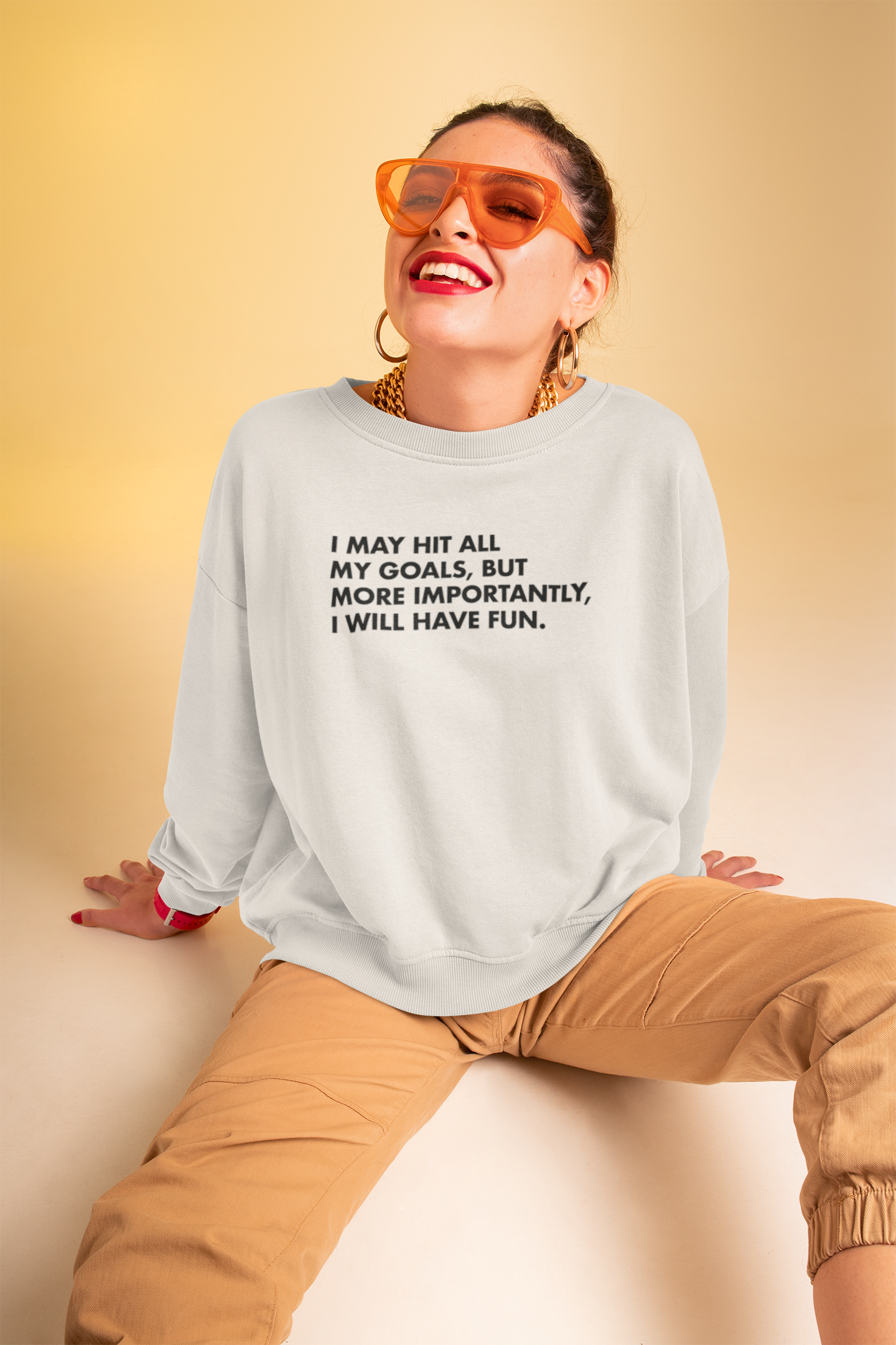 sweatshirt-mockup-featuring-a-woman-with-trendy-sunglasses-at-a-studio-m639.png