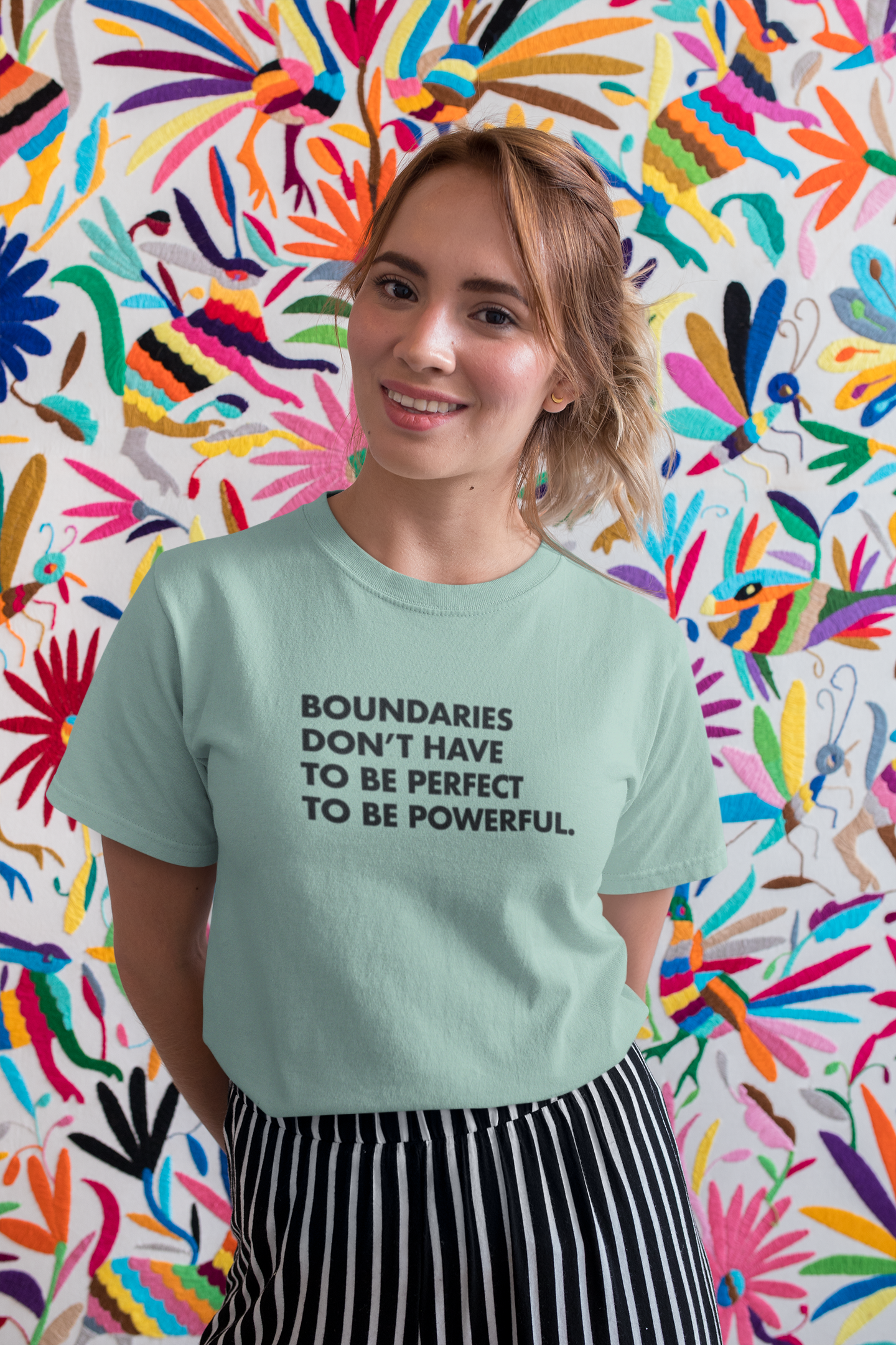 t-shirt-mockup-of-a-pretty-woman-smiling-in-front-of-a-colorful-background-26643.png