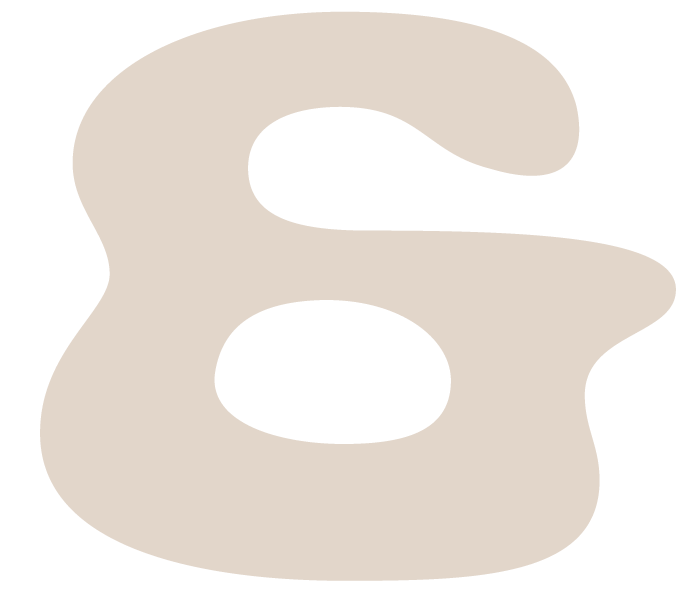 Close-up of an abstract, beige shaped object with black background