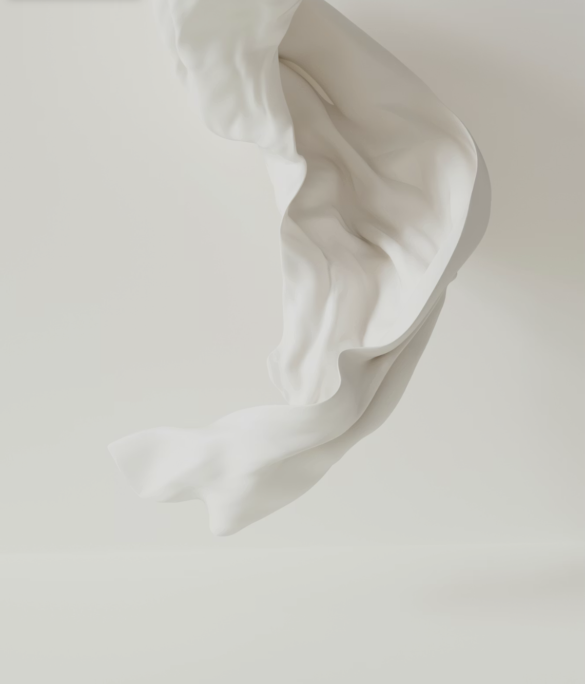 Close-up of a swirling pool of white cream or lotion against a plain, light background.