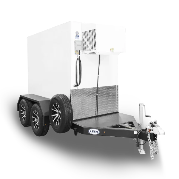 A mobile freezer trailer with black tires, a white insulated body, and a hitch for towing.