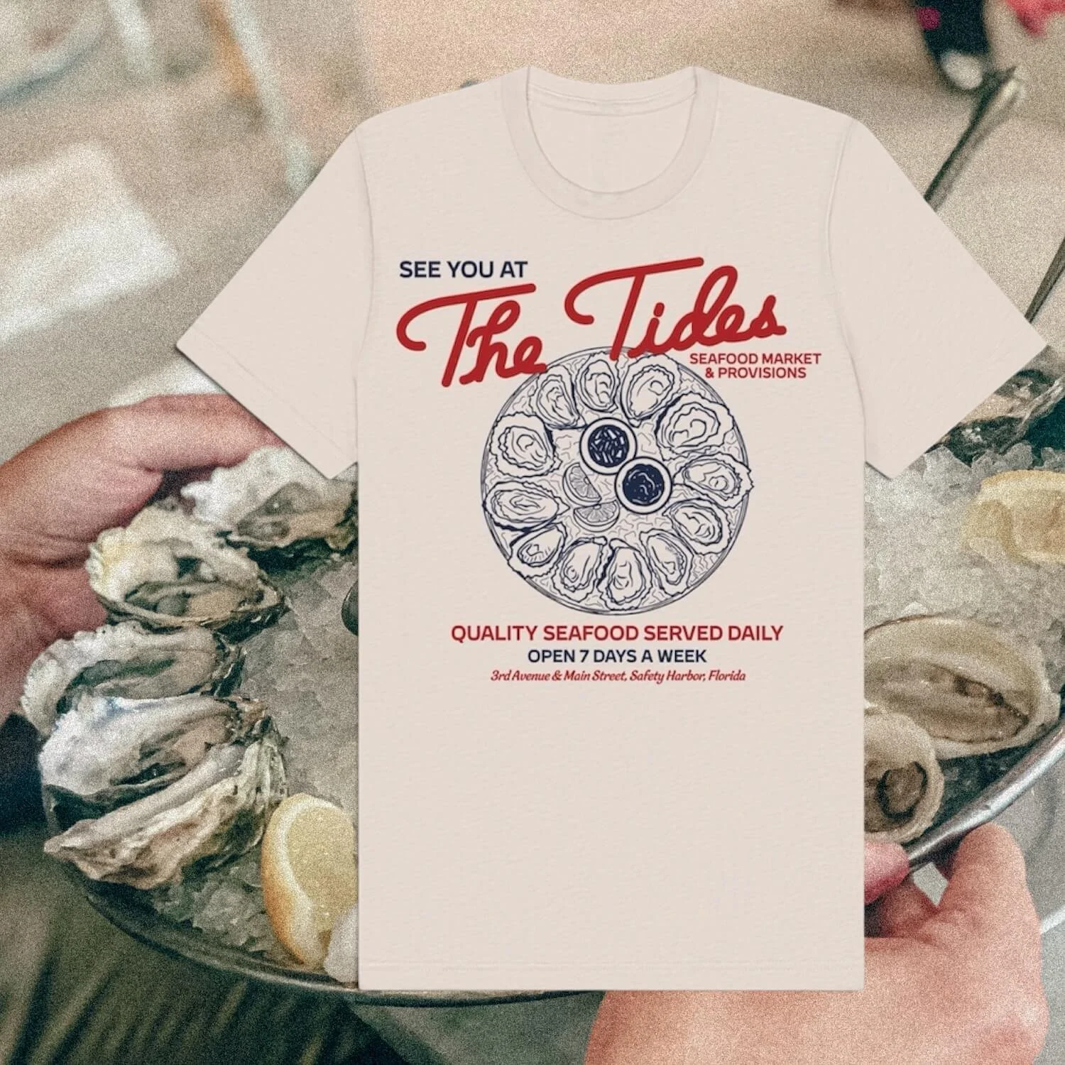 Flyer for The Tides seafood market showing an illustration of a seafood platter and text about seafood offerings and location in Florida.